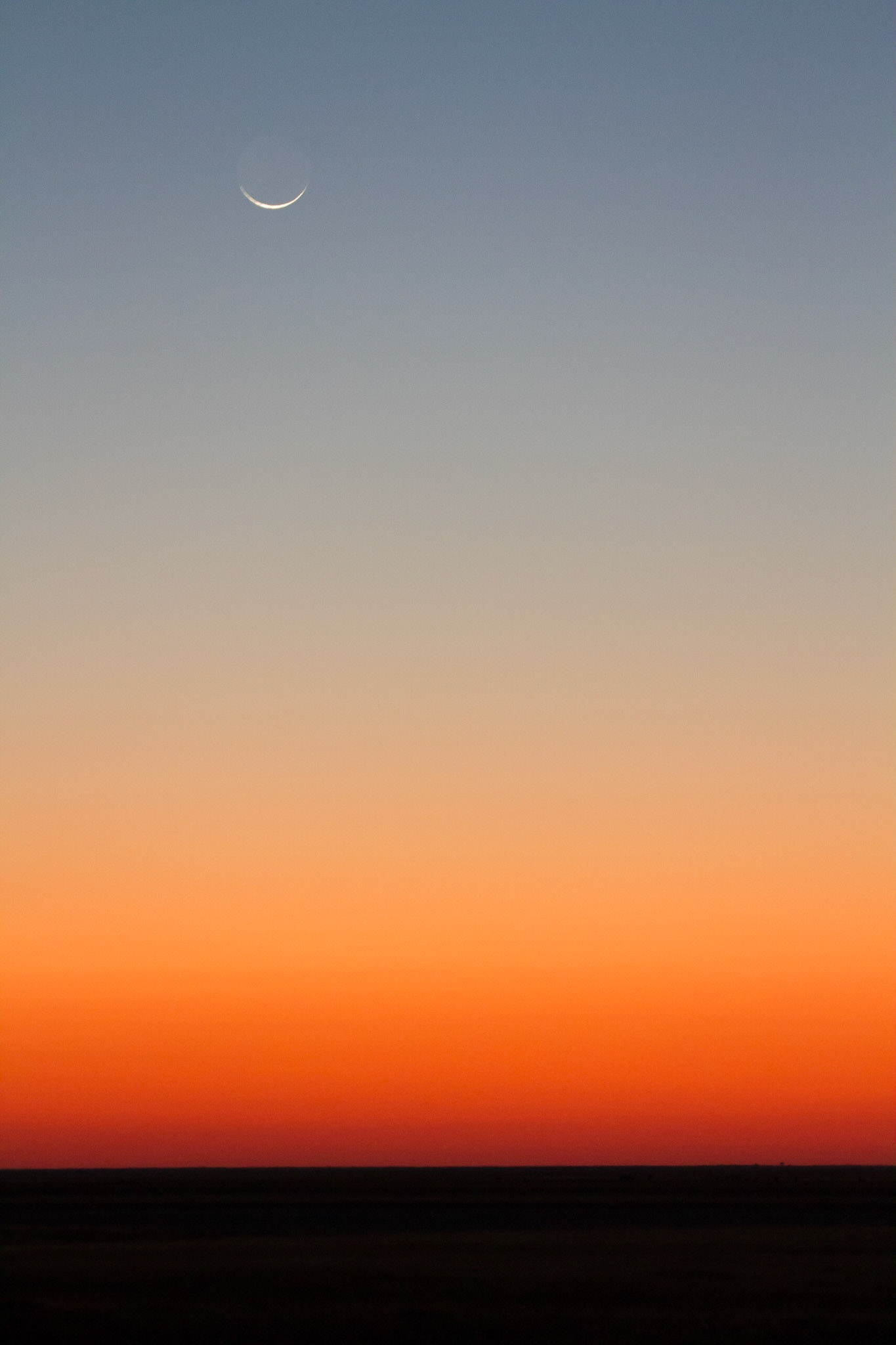 New moon above the sunset, Makgadikgadi