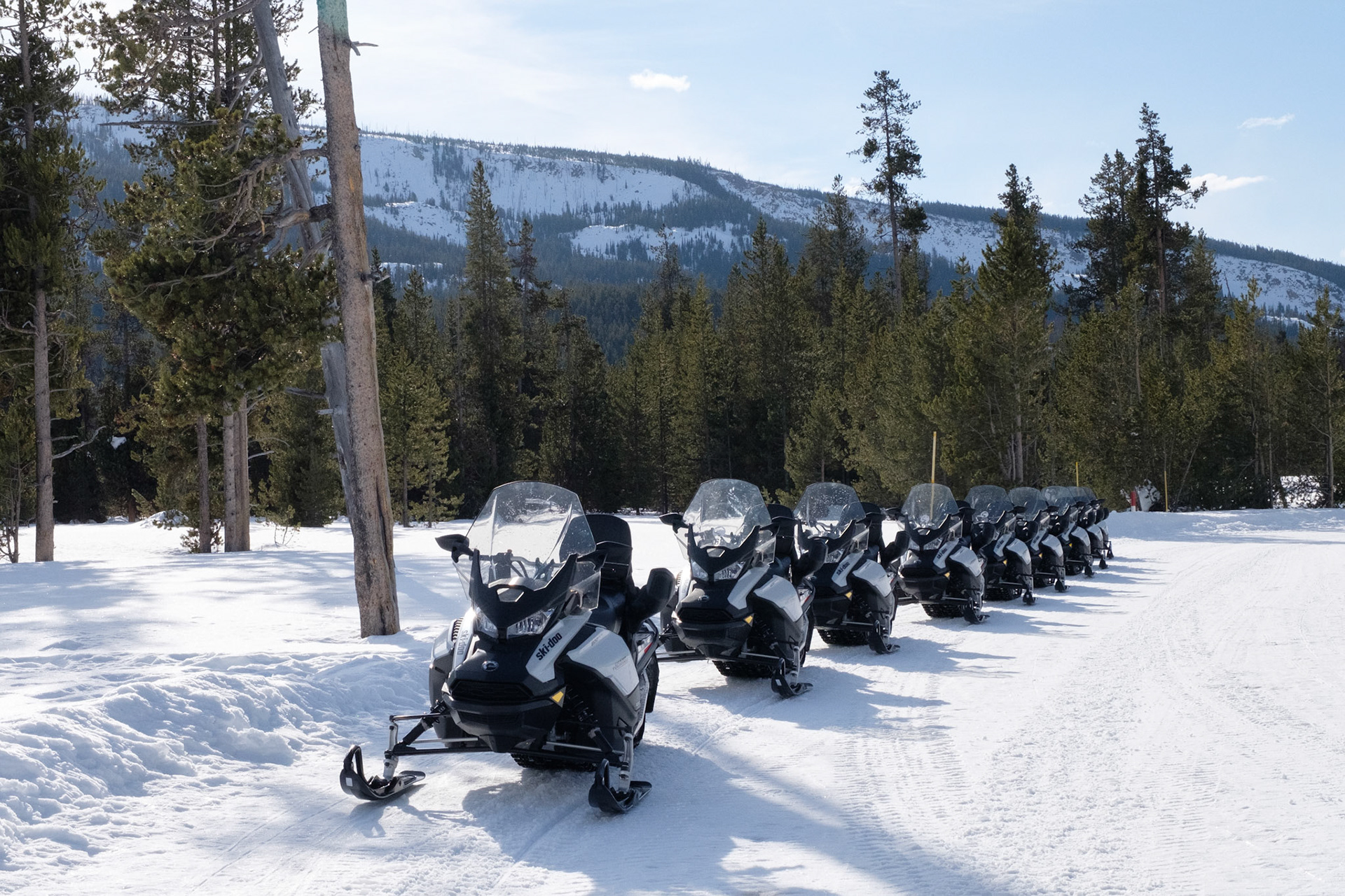 Our snowmobiles at the entrance to Yellowstone