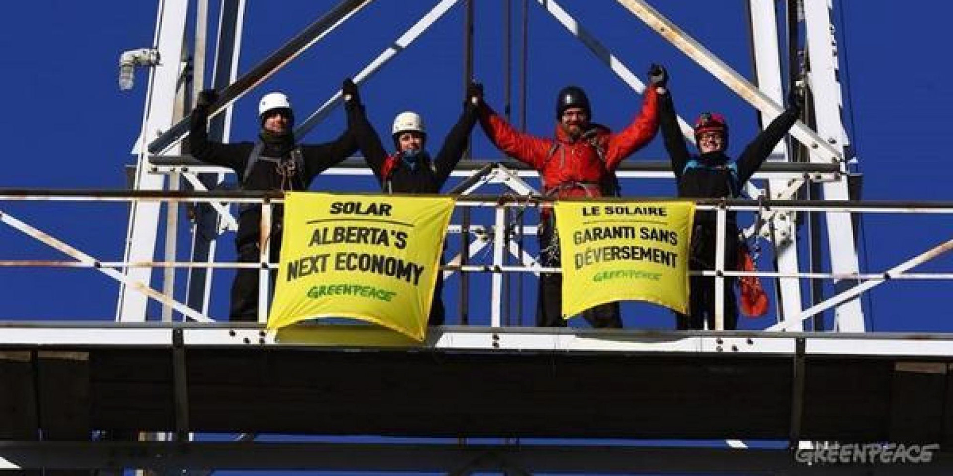 Brave Greenpeace volunteers climbed Alberta's first oil derrick to mount signs.