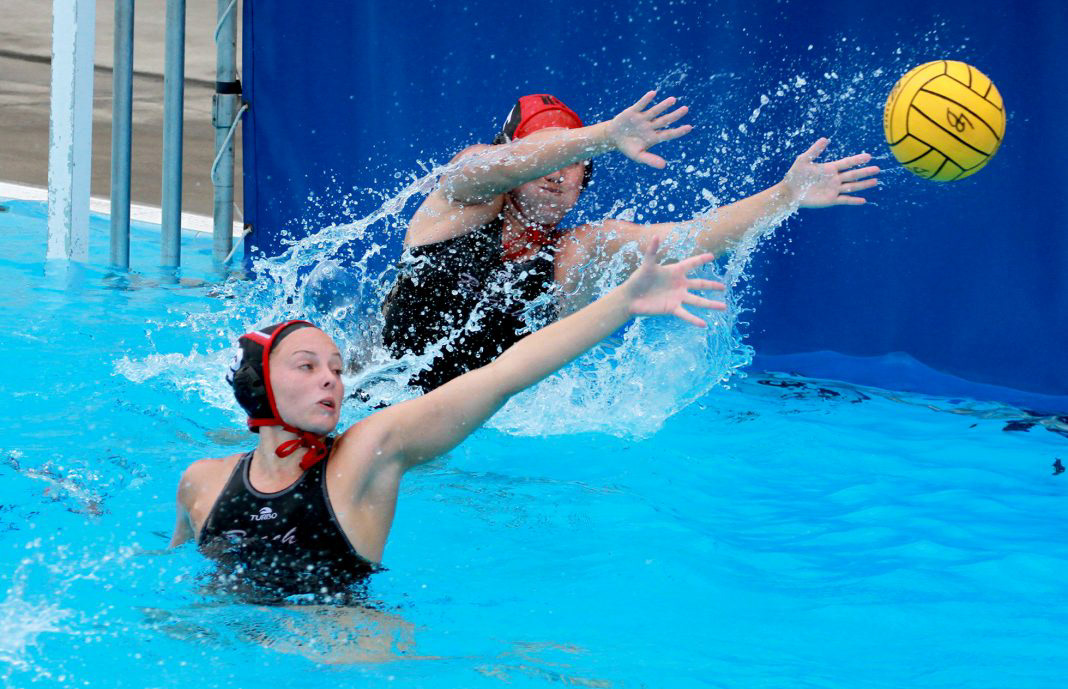 Defender Karissa Qualley and goal keeper Cami Owens block the ball from Pasadena.