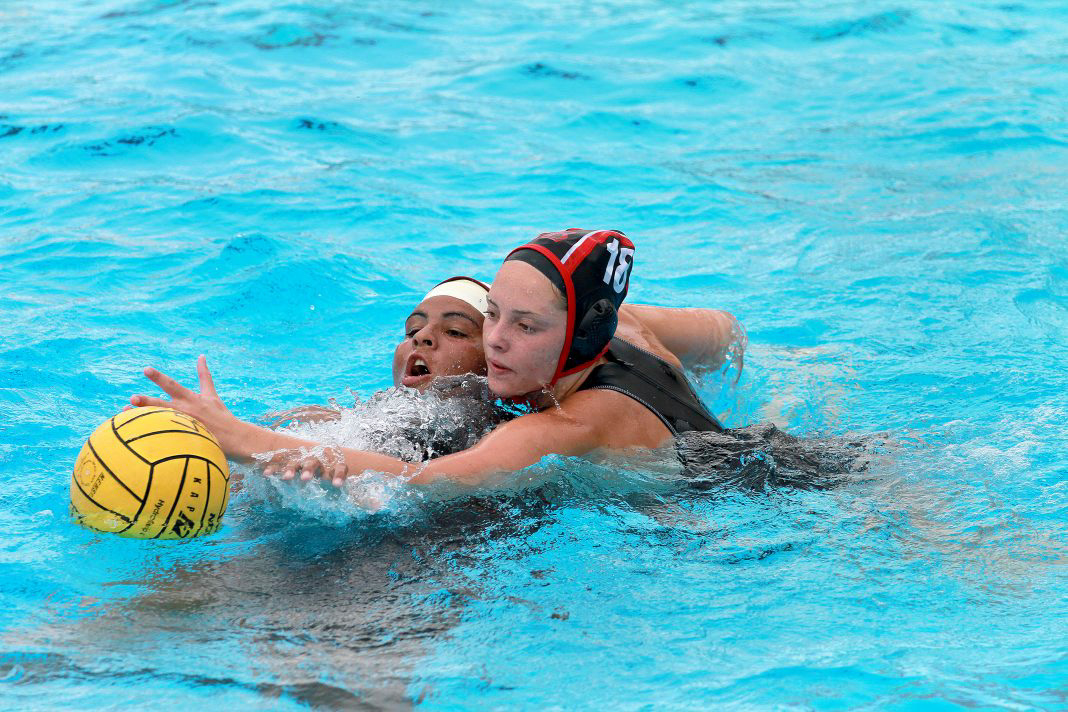Defender Karissa Qualley blocks opposing team.