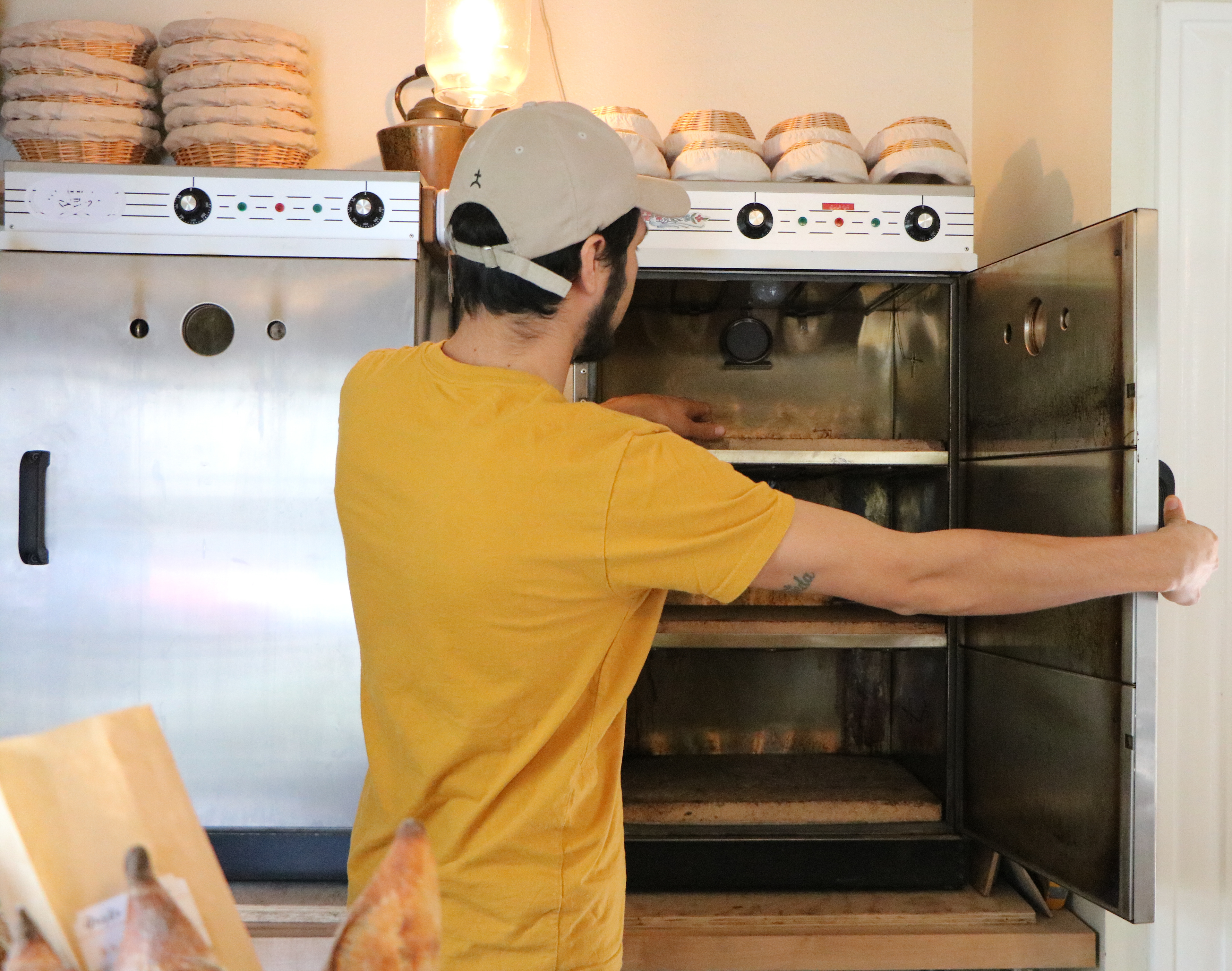Owner of Gusto Bread, Arturo Ensciso bakes his bread in his living room.