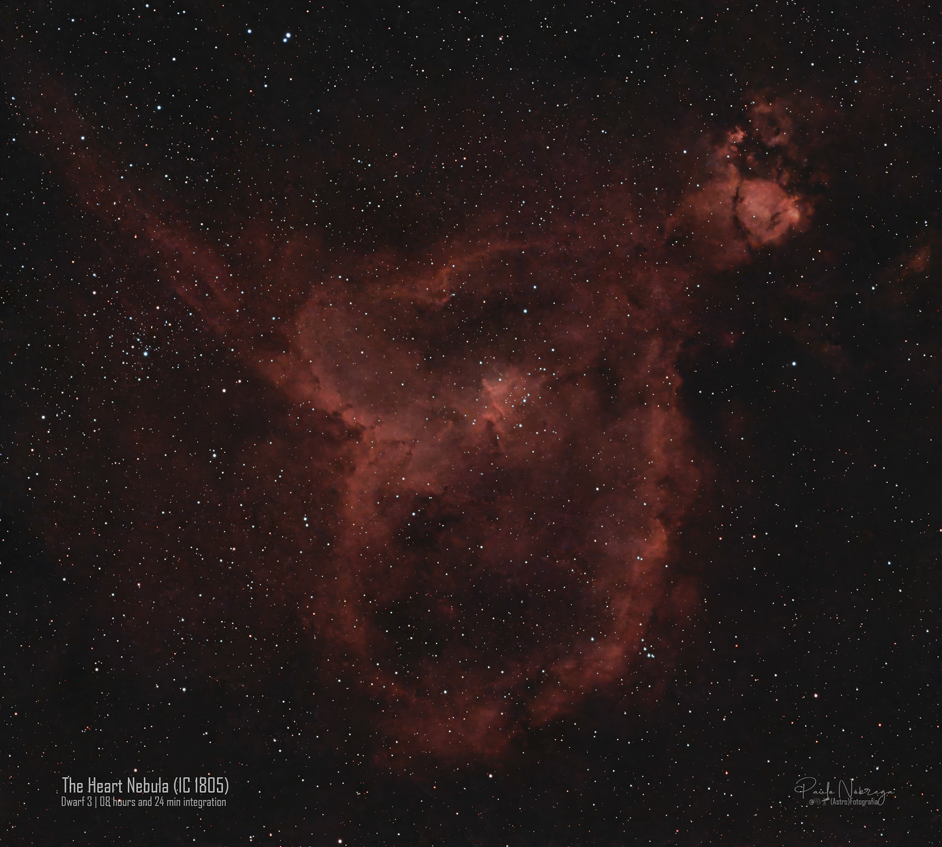 The Heart Nebula (IC 1805 / Sharpless 2-190) — Emission Nebula in CassiopeiaLocated roughly 7,500 light-years away in the Perseus Arm of our galaxy within the constellation Cassiopeia, the Heart Nebula is an expansive star-forming complex glowing brightly in ionized hydrogen (H-alpha). This deep-sky astrophotography capture reveals the nebula's distinctive heart-shaped silhouette, powered by Melotte 15—a dense central open cluster of energetic young stars whose intense radiation and stellar winds sculpt the towering dust pillars and carve out the surrounding cosmic cavities.
