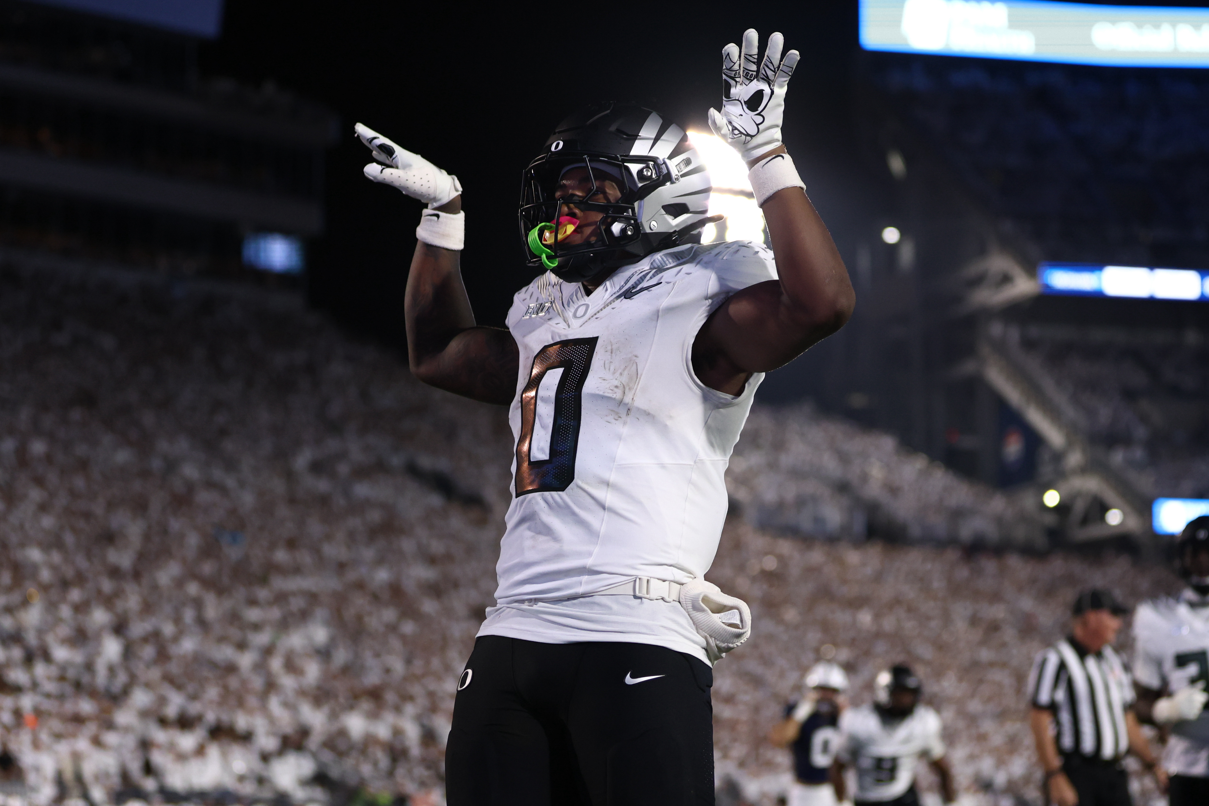 Oregon Ducks running back Jordon Davison (0) celebrates after scoring a touchdown during Penn State's White Out game against Oregon at Beaver Stadium on Saturday, Sept. 27, 2025 in University Park, Pa. The Ducks beat the Nittany Lions in double OT 30-24.