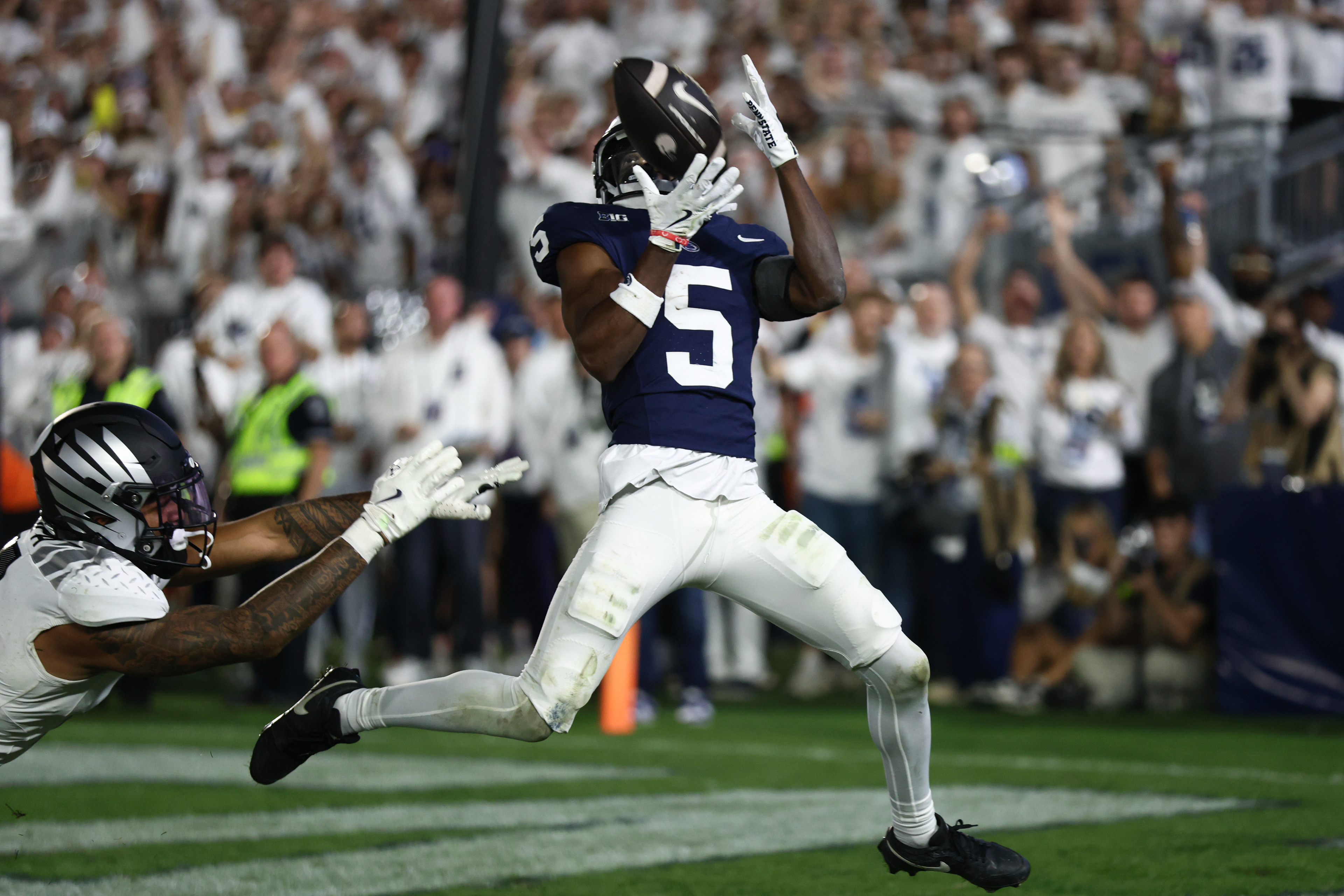 Penn State Nittany Lions wide receiver Devonte Ross (5) catches a ball for a touchdown during Penn State's White Out game against Oregon at Beaver Stadium on Saturday, Sept. 27, 2025 in University Park, Pa. The Ducks beat the Nittany Lions in double OT 30-24.