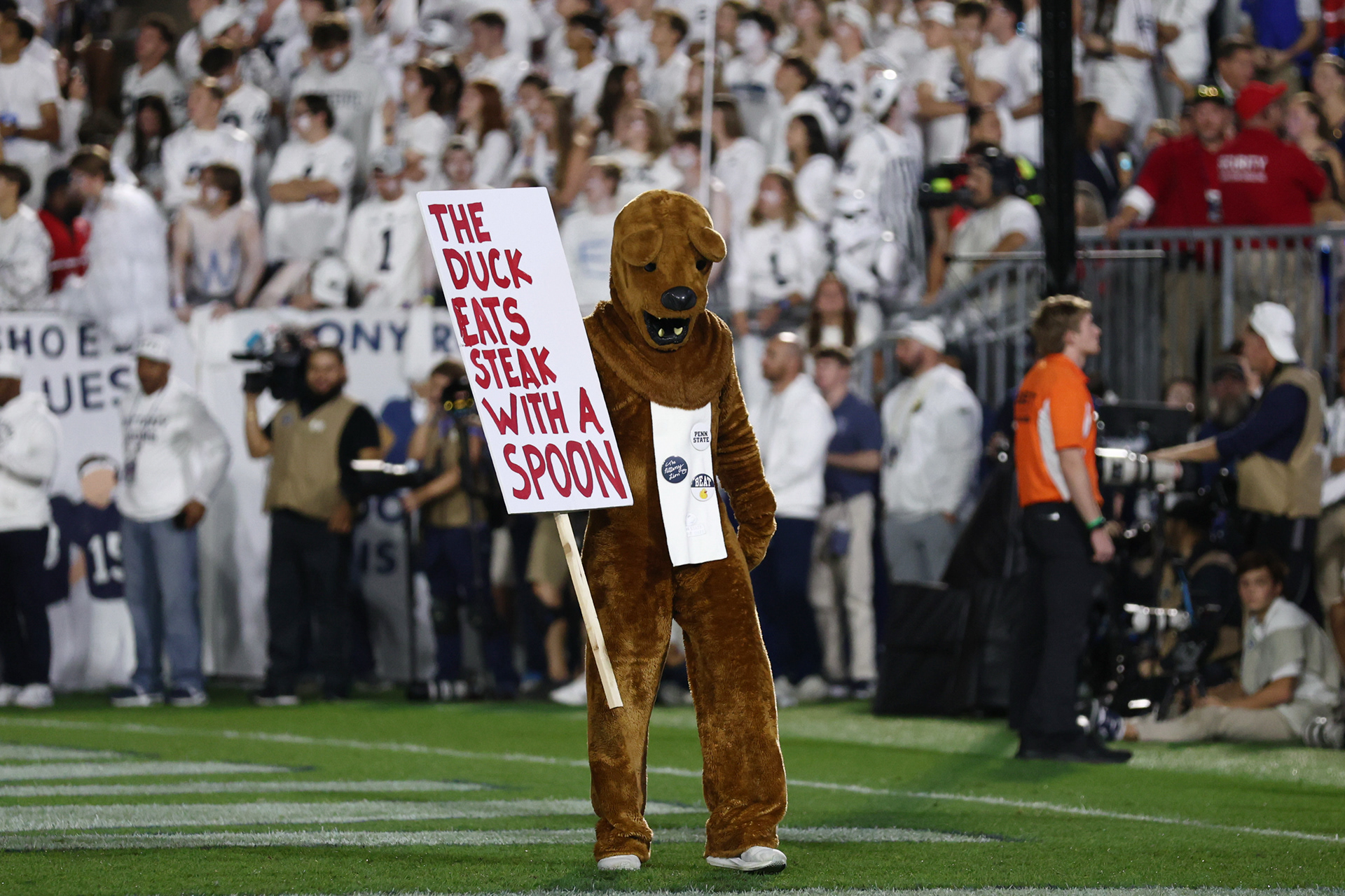 The Nittany Lion stands with a sign during Penn State's White Out game against Oregon at Beaver Stadium on Saturday, Sept. 27, 2025 in University Park, Pa. The Ducks beat the Nittany Lions in double OT 30-24.