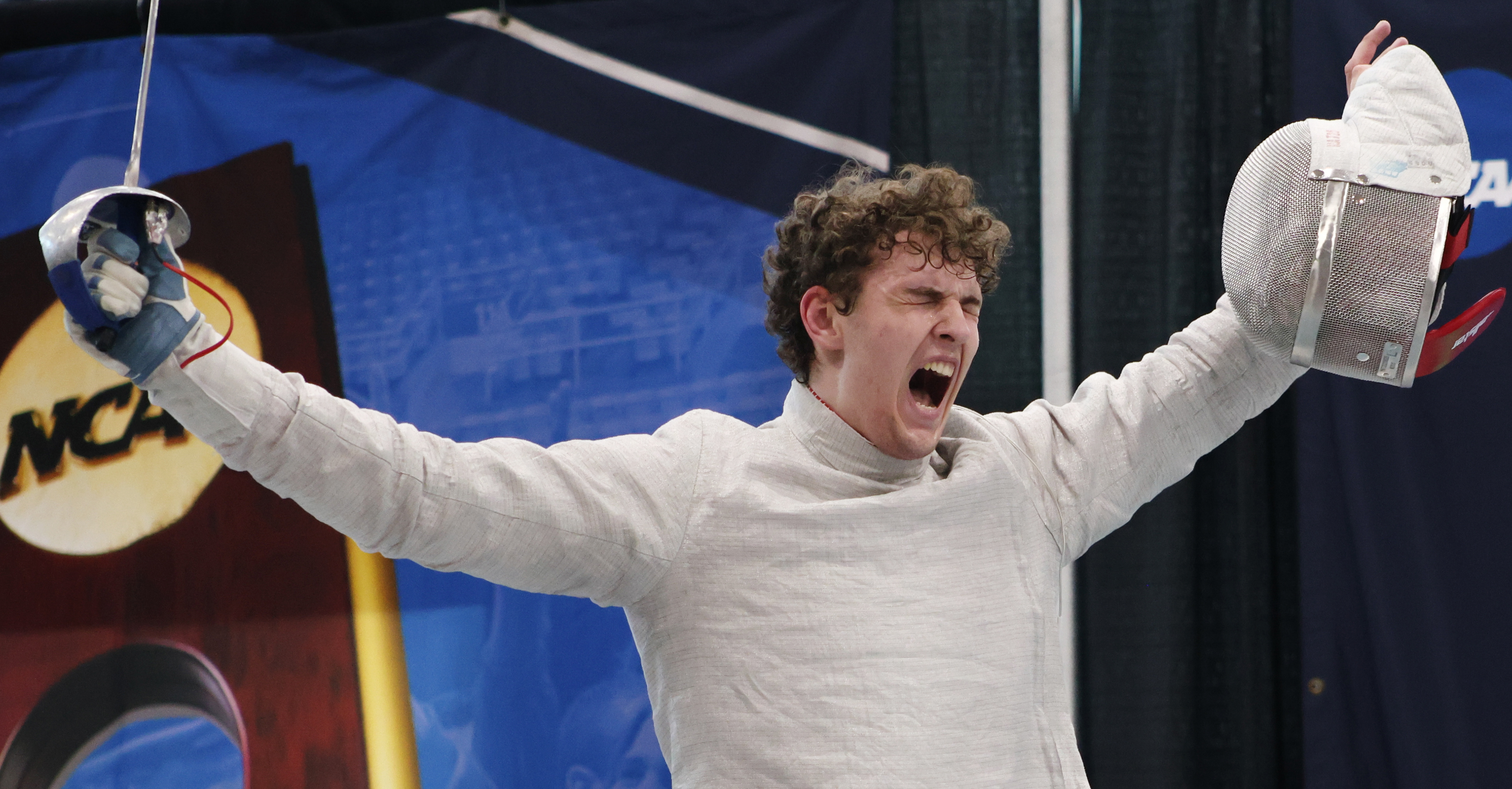 St. John's Fencer Darii Lukashenko celebrates with this hands up after placing first in the men’s sabre division of the NCAA Fencing Championship at the Multi-Sport Indoor Facility in University Park, Pa, on Friday, March 21, 2025.