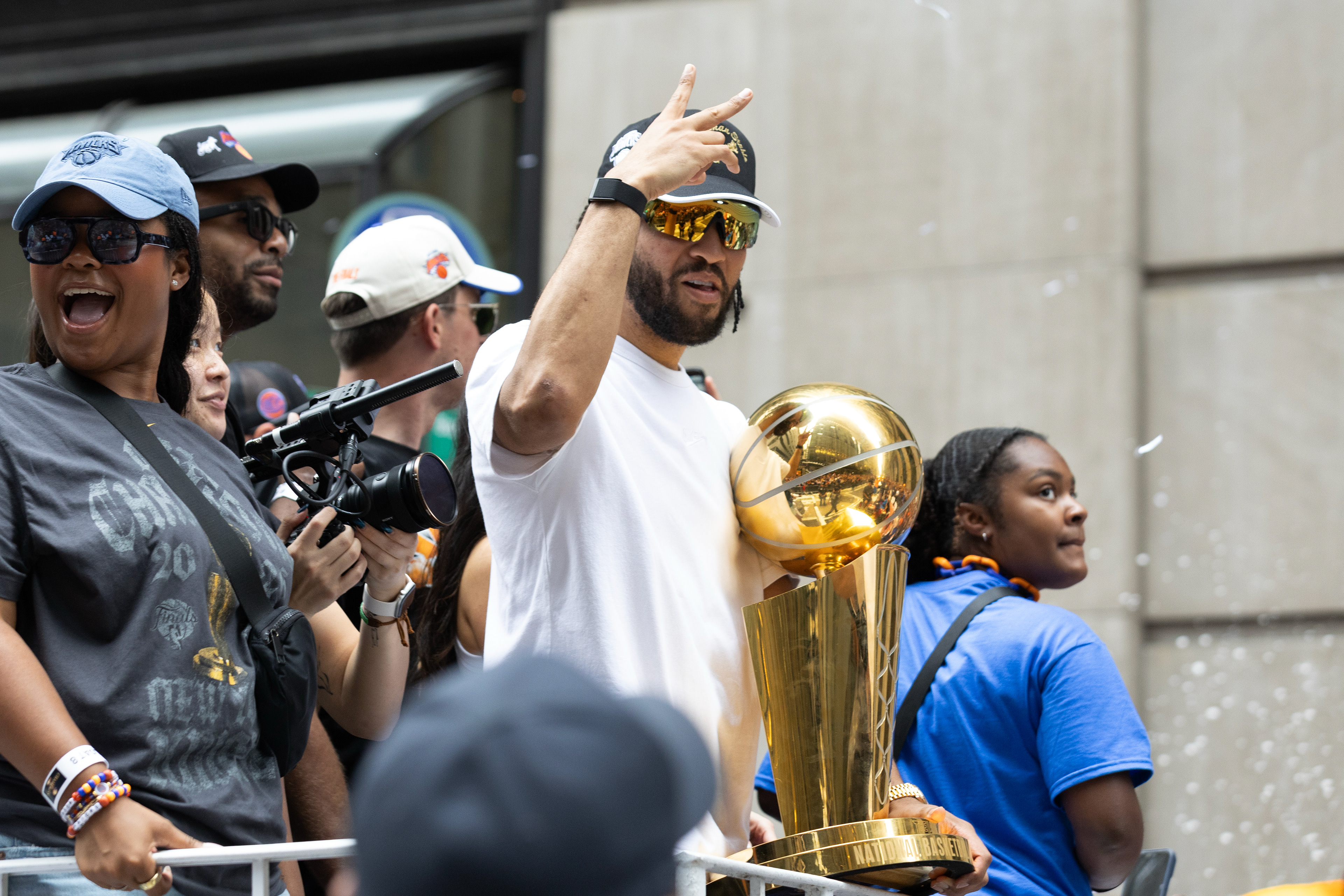 New York Knicks guard Jalen Brunson (11) holds the Larry O’Brian trophy during the Knick’s ticker tape parade on Thursday, June 18, 2026 in New York, N.Y.