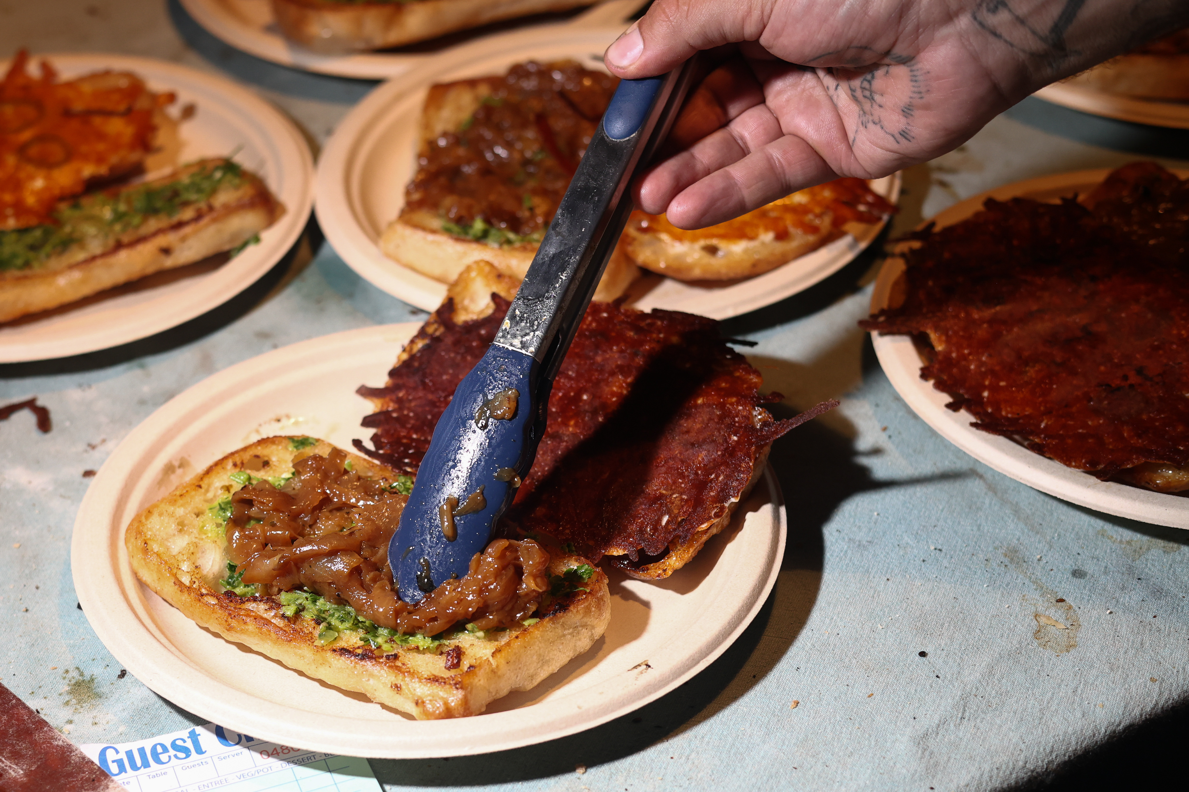 Caramelized Onions are put on a toasted ciabatta roll on Friday, Aug. 1, 2025 at Zeebo's Beast Feast in Long Beach, NY.