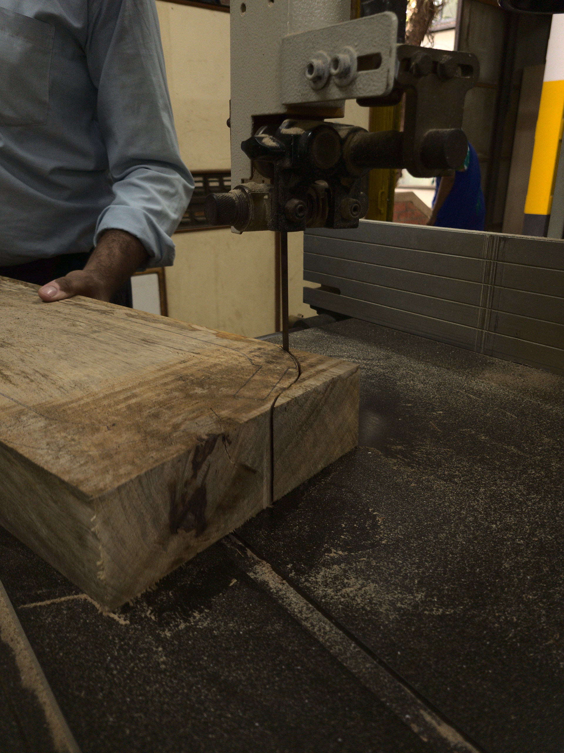 cutting the wood on band saw