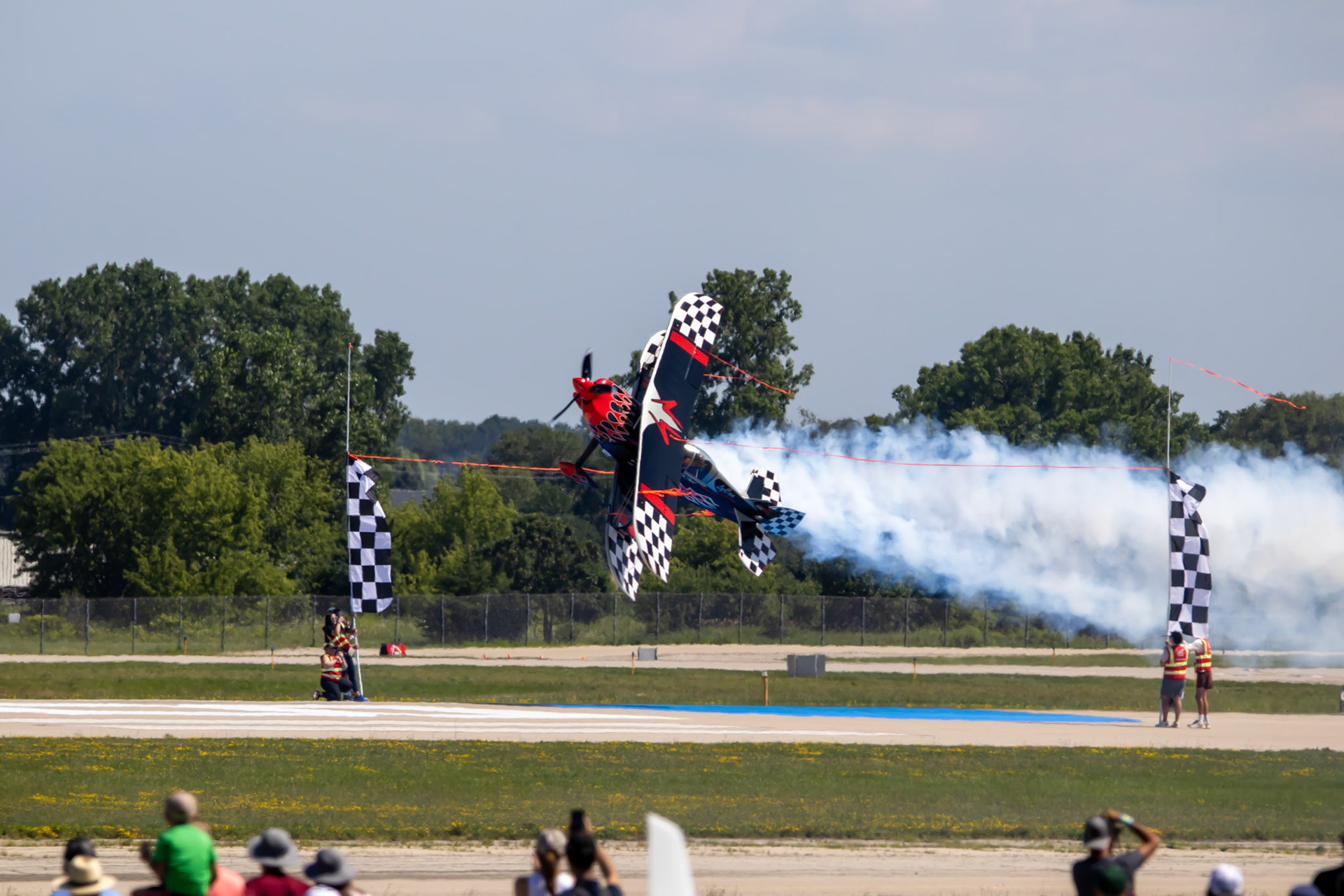 Skip Stewart flys sideways and cuts a ribbon