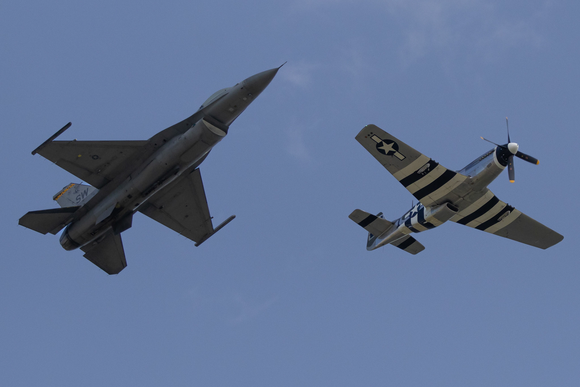 Underside of a F16 and P51 Herritage Flight