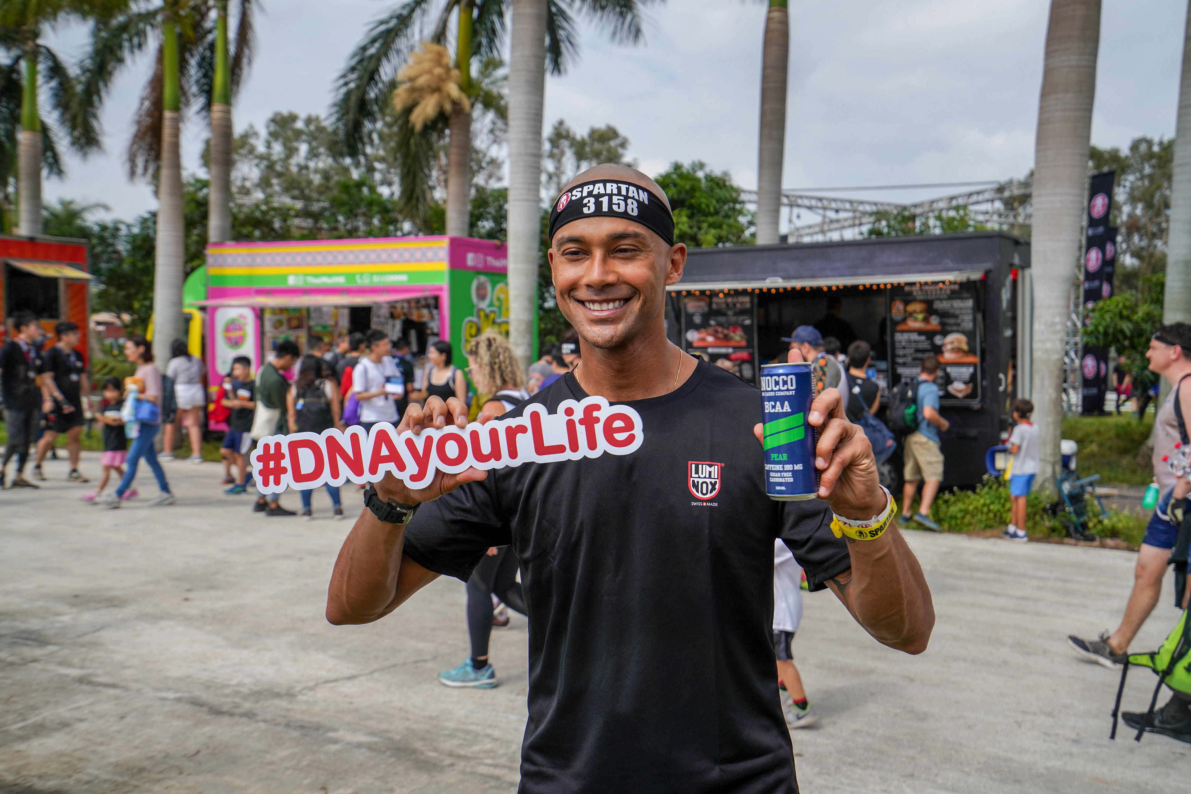 Winner of the challenge holding our #DNAyourLife sign.