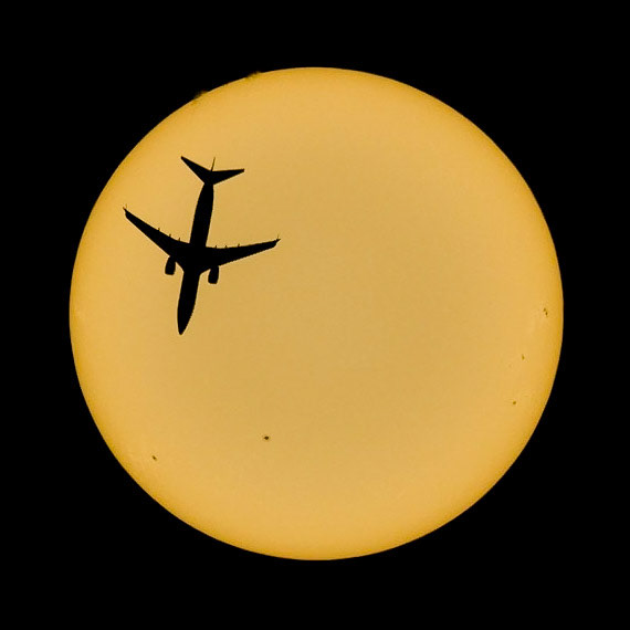 United flight 2119 passes in front of the Sun, seen Saturday from the Space Coast of Florida. From my driveway, to be precise. From a travel perspective, these are pretty much the easiest shots I capture, as I'm merely walking a few feet out the front door. For this shot, I had about 15 misses before this flight zipped by. The Boeing 737-824 was traveling from Newark, NJ (EWR) to George Town, Cayman Island (GCM) @ 36,000 ft &amp; 467 knots. (📷:me, w/ flight data &amp; tracking by Flightradar24.com)