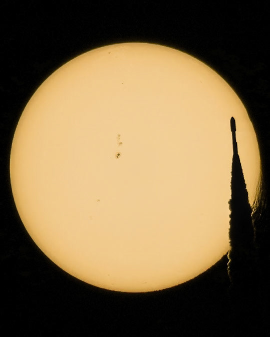 I've had some success capturing various things passing in front of the Sun and the Moon, but this is the first time I've caught an AtlasV rocket transit, and oh, what an AtlasV it was. Flying with five solid rocket boosters strapped on, the CEO of United Launch Alliance has nicknamed this AtlasV configuration "The Bruiser." It's an apt name.At 8:47 a.m. Sunday, September 10, United Launch Alliance launched "The Bruiser," sending the NROL-107 satellite Silentbarker to orbit. The joint national security mission for the National Reconnaissance Office and the Space Force's Space Systems Command - SSC is reported to be a success, resulting in a "high-priority" payload being delivered "directly to Geosynchronous Orbit." (Source: ULA)With the help of flightclub.io, I mapped out 12 possible shooting locations all over Titusville, all chosen with the hope of getting this shot at any point through the launch window. I traveled light; usually, I set 2 or more cameras, but for this launch, it was a single-camera operation. For the first spot for the start of the launch window, there was a multi-story building one block away and between me and the pad. This meant I couldn't see the rocket until it cleared the building; at that point, it was too close to the Sun to see it without welding goggles. So, at T-0, with the Sun in the viewfinder low and to the left of the center, I pressed record (8k, ftw) and watched the camera screen. I had calculated the transit would occur ~45 seconds in flight, and that's an excruciating amount of time to wait. At T+47 seconds, I was ready to accept failure, but just then, a dark line zipped across the right side of the Sun, and the plume that followed was unmistakable. My head exploded. When I could sit and look at the scene, for the briefest of moments, "The Bruiser" looked like it made the Sun melt, both as the rocket approached and passed by. You can see the activity in the series below, or check out the full-motion and slowed video, linked below. It's well-explained by Dr. Philip Metzger on the Twitter, aka X.com: "The refraction of light is caused by variations in density of the air. Density can be varied by either pressure or temperature (or both). You can see both effects in this video. [Near the top of the rocket] are shockwaves which vary both the pressure and temperature, so light bends in the shockwave. Previously dark areas can be bright or previously bright areas can be dark depending on where the bent light came from." He also explains the effect on the Sun as the rocket passes by as "variation of the temperature around the plume causing variation in air density, also bending the light."And Dr. Thomas Zurbuchen put it very elegantly: "Want a space pic which includes solar activity, advanced aerodynamics, and a rocket all at once? Look no further - Mike Seeley has got it". TL;DR: The Bruiser and the Sun walk into a bar...Video (preferably watch in 4k): https://youtu.be/ByVwk-xCaKA?si=dPi2luiVSxwOP8lR