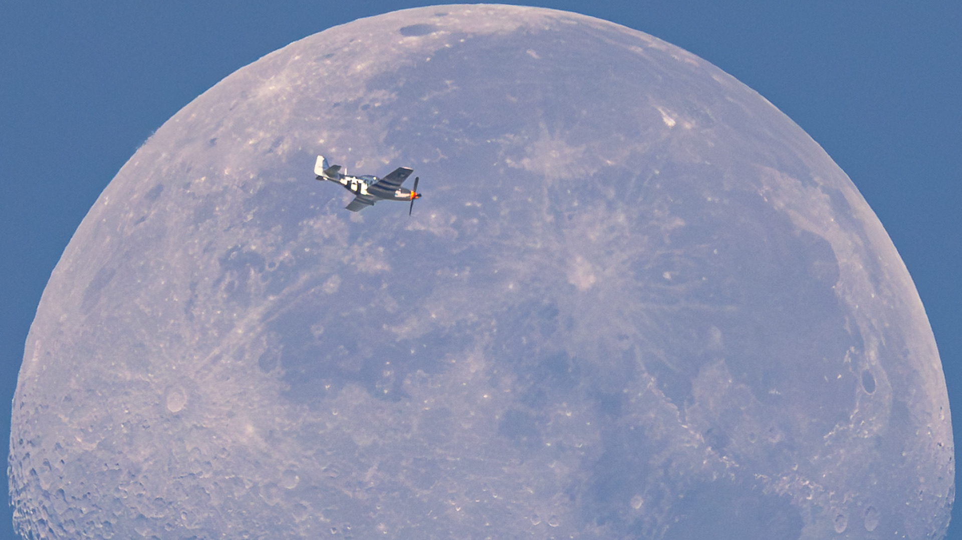 A North American F-51D Mustang (reg N51KB) transiting the Moon Saturday morning as it flew over the Space Coast of FL. It was flying at 10,425 ft &amp; 252 knots as it traveled from Stuart (SUA) to Vidalia (VDI).This was a fun, rare catch; of over 15,000 built during WWII, only ~150 are still operable.(📷: me, flight data by Flightradar24.com)Details: ISO640, 1/2000-sec &amp; f10, shot with a Canon R5 and RF100-500L with a 1.4x TC, handheld (I/S ftw); post-processing in Lightroom