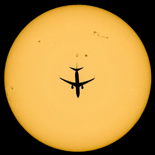 Lots of sunspot activity today as Delta Air Lines flight 582 passed in front of the Sun earlier, seen from the Space Coast of Florida. The Boeing 737-932 was traveling from Atlanta, GA to Oranjestad, Aruba at 34,000 feet &amp; 465 knots. (📷: me, flight data by Flightradar24.com)