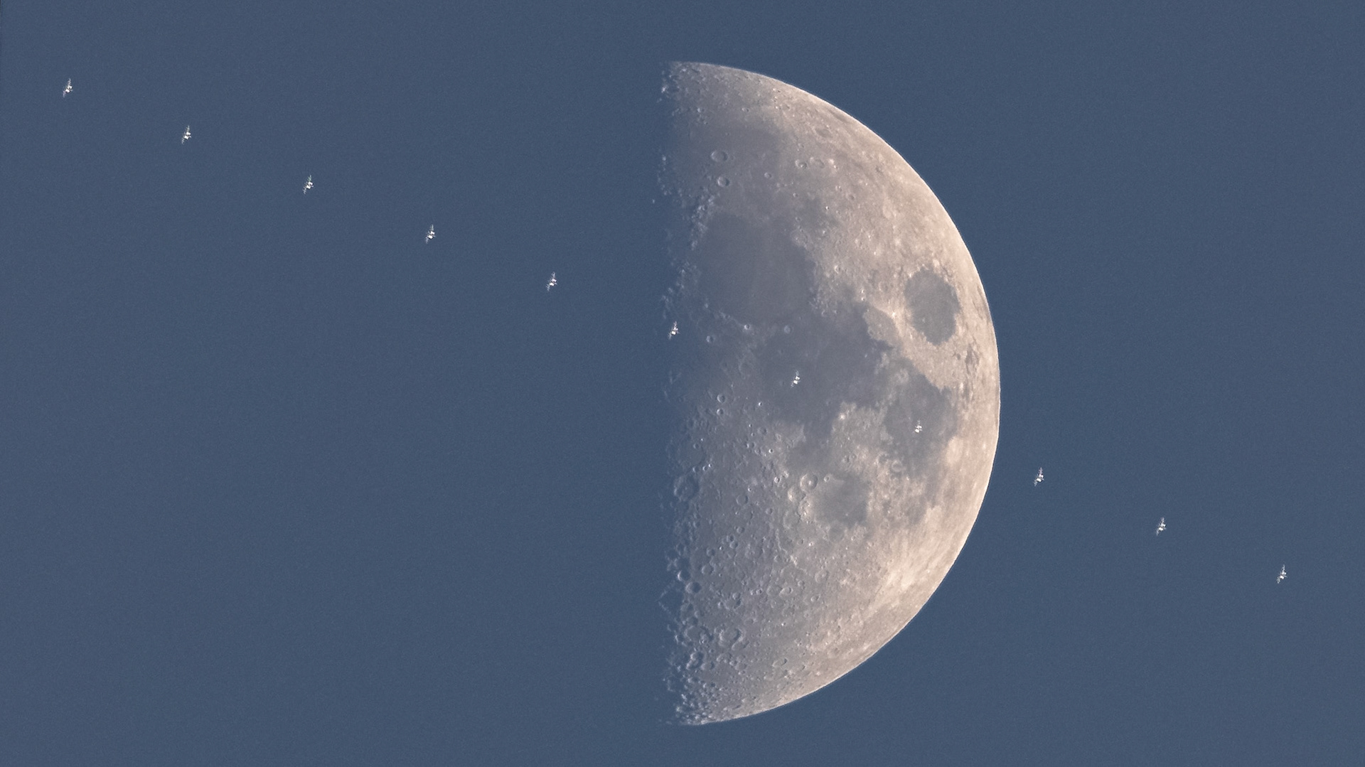 For my second transit in one day, may I present, traveling at 17,500mph, the International Space Station passing in front of the First Quarter Moon, seen Wednesday evening from Mims, Florida.