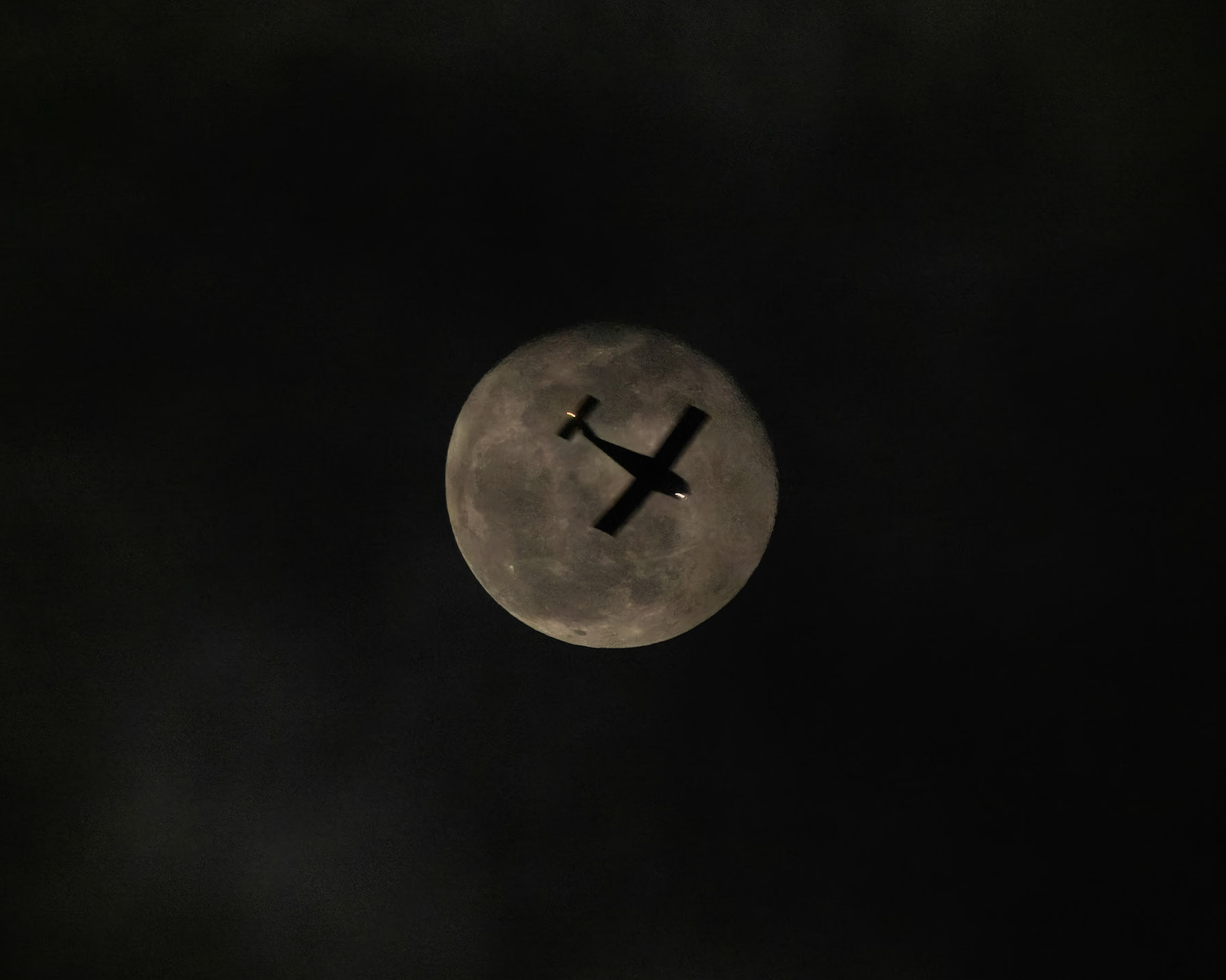 And for my third night as the old man yelling at clouds, there's this episode from Saturday at 11:15 pm. Earlier in the night, the Moon was mainly unobscured as it rose through the flight paths near my house, but the cloud cover was nearly complete when I started looking at Flightradar24 for lucky transits. I had been watching this Beech 77 Skipper (thank you, Flightradar24) meander south from St. Augustine along I-95. Flying at 5,500 feet at a speed of 81 knots, it was pretty much the least exciting thing in the sky last night. Its track was rather inexact, and I thought it would stay west of me. But as it got closer (I could actually hear it as it approached), I stuck my head outside, found the smudge that was the Moon behind the thick clouds, and to my amazement (and disgust at the conditions), N6754W (private owner) was nearly perfectly aligned with the Moon.The photo is a mess -- for the photo nerds, this is ISO2000, f7.1 and 1/80 second, handheld. The exposure is pushed two stops in post, and I'm surprised the autofocus could even find anything to lock onto. I'm also experimenting with a noise reduction plug-in, and that's been deployed here. Too Long; Didn't Read: I'm ready for the clouds to be gone, and I spend way too much time looking at the Moon.