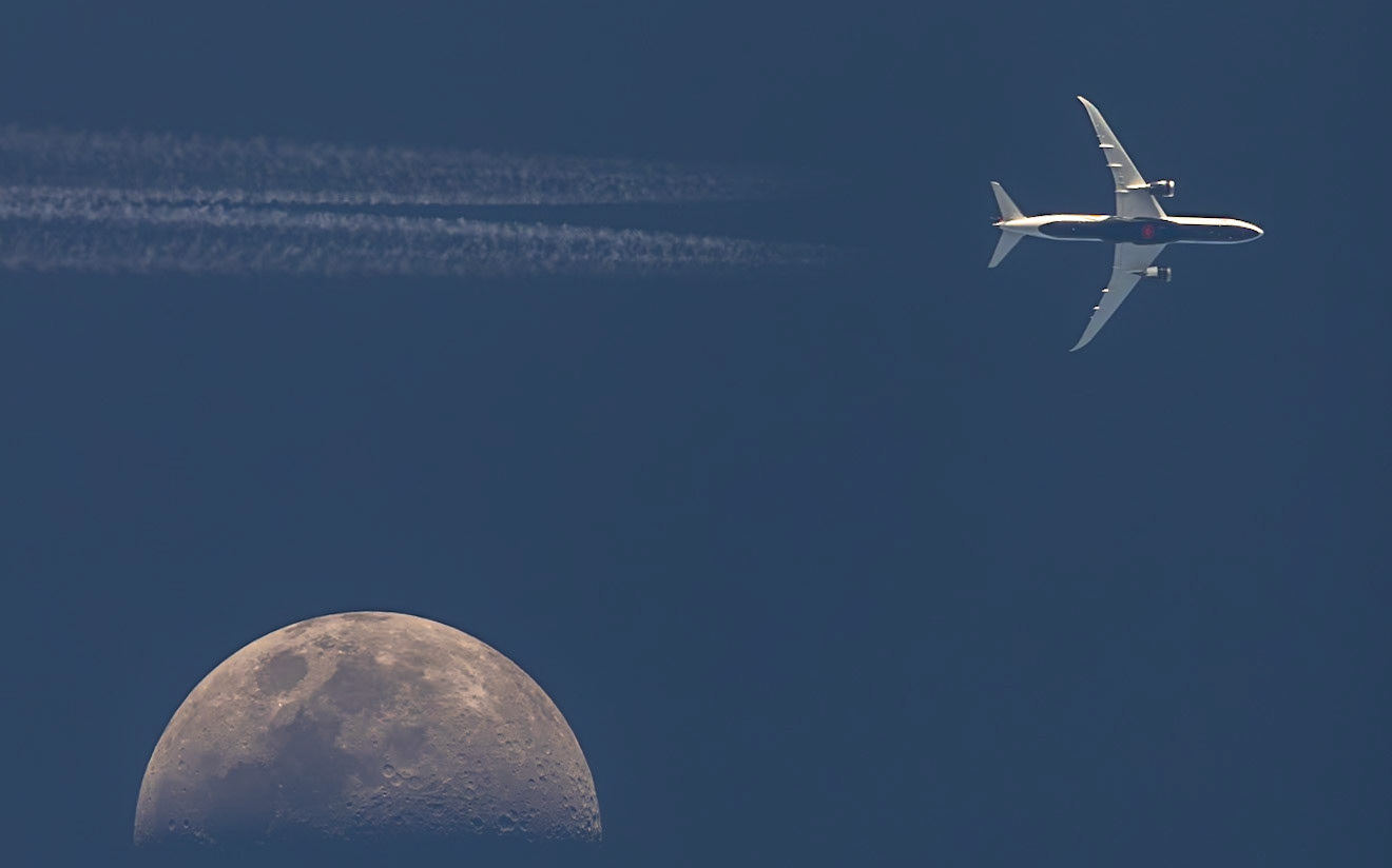 close (adjective)being near in time, space, effect, or degreeThese almost-lunar transits from Saturday are mainly remarkable because of the planes involved, both of them huge and photogenic from a #planespotting perspective. The unbothered Moon is almost secondary. I was tracking the first jet closely, a Boeing 787-9 Dreamliner (reg C-FVLX, listed as "Disney Wish Livery"). The timing seemed right for a direct hit, but Air Canada flight 1202 from Toronto (YYZ) to Miami (MIA) was traveling two-ish minutes too fast, and it passed just to the right of the Moon, 36,601 feet above me and moving at 458 knots. When a plane is that close to a transit (and to the west of the Moon/Sun), anything on that same flight path between two and six minutes behind is in play for a direct hit. A Boeing 747 was coming down the route, but I estimated it would be ten minutes behind the 787. Generally, I don't chase plane transits; all but two I've captured have been from my driveway. But I made an exception for a close 747. The second shot shows the result: another miss, this time on the other side of the Moon. The 747 was a tad slower than I estimated, but even if I accounted for the extra 2 minutes (it arrived 12 minutes after the 787), I still needed to be about three times further east than I was. But even if it is not passing in front of the Moon, it is still a magnificent plane, indeed the "Queen of the Skies." It's a Boeing 747-87UF (reg N856GT) operated by Atlas Air Worldwide Holdings as flight 5Y8052, traveling from Anchorage (ANC) to Miami (MIA), 34,000 feet above me.Big thanks to TPE for helping me gauge the Moon's position and, of course, to Flightradar24.com for the flight data. "close" definition by Merriam-Webster Dictionary.
