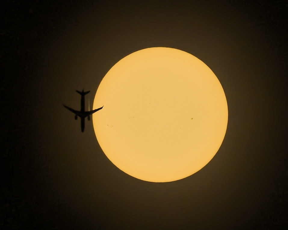 Welcome to the Sunshine State: That's Air Canada flight 1206 passing very near the Sun today, seen from the Space Coast of Florida. The Airbus A220 was travelling from Montreal (YUL) to Miami (MIA) @ 34,000ft &amp; 451kts. Image captured with a Canon R5 &amp; RF100-500mm w/ 1.4x TC with a solar filter (mandatory); the solar filter is why the area around the Sun is dark; I initially dismissed the image when I saw just the wing hit, but there was enough data to bring out the plane.(📷:me w/ flight tracking &amp; data by Flightradar24.com)