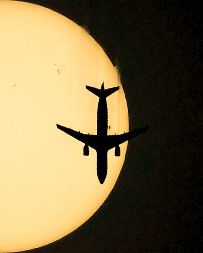 An Airbus A320-214 caught zipping by the Sun (&amp; a huge sunspot), seen Saturday from the Space Coast of Florida.This is American Airlines flight 2615, traveling from Washington (DCA) to Nassau (NAS) at 29,991 ft &amp; 485 kts.(📷: me, flight data by Flightradar24.com)