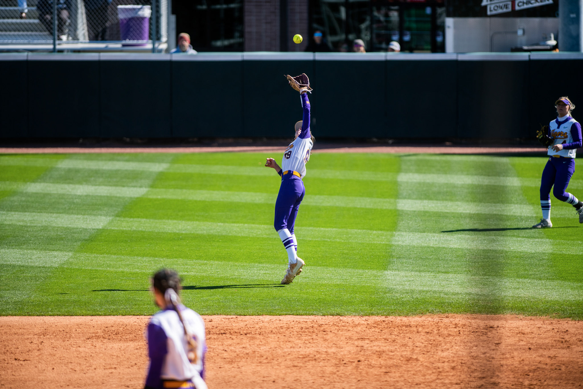 LSU softball redshirt freshman infielder Presley Pilon (99) catches a pop fly in the gap between center and left field Saturday, March 12, 2022 during LSU's 13-6 win against Alabama at Tiger Park in Baton Rouge, La.