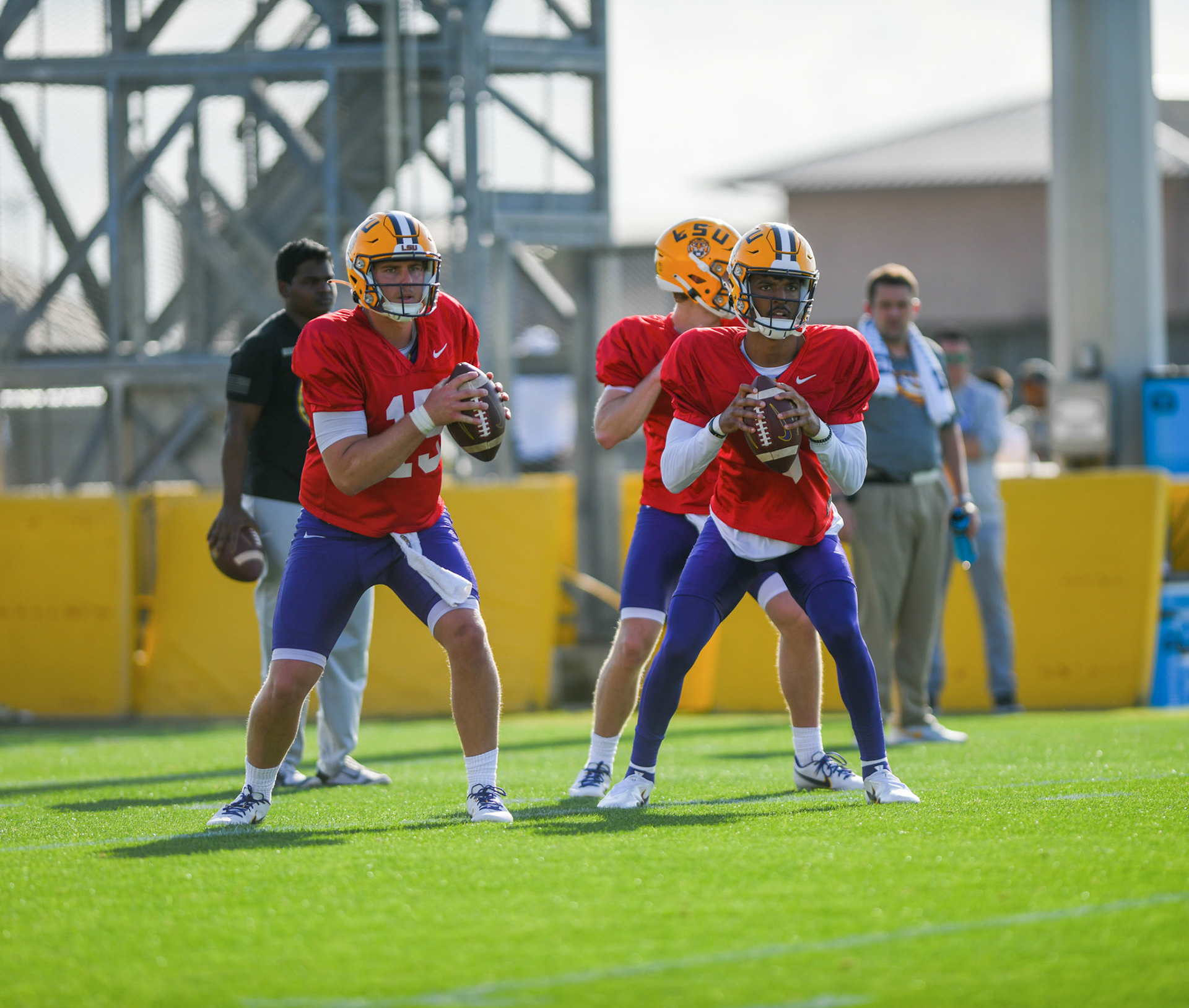 LSU football quarterbacks Myles Brennan (15) and Jayden Daniels (5) look for a receiver Tuesday, March 29, 2022 during LSU's spring practice in Baton Rouge, La.