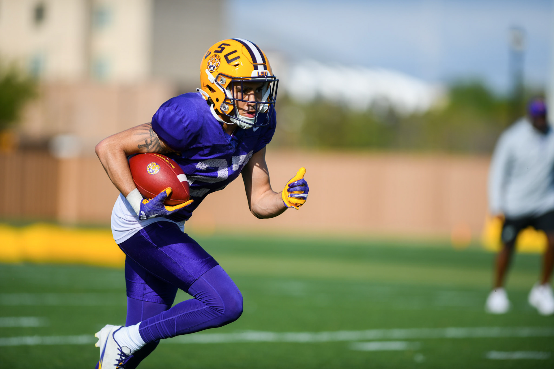 LSU football defensive back Ralph Walker (27) runs the ball Tuesday, March 29, 2022 during LSU's spring practice in Baton Rouge, La.