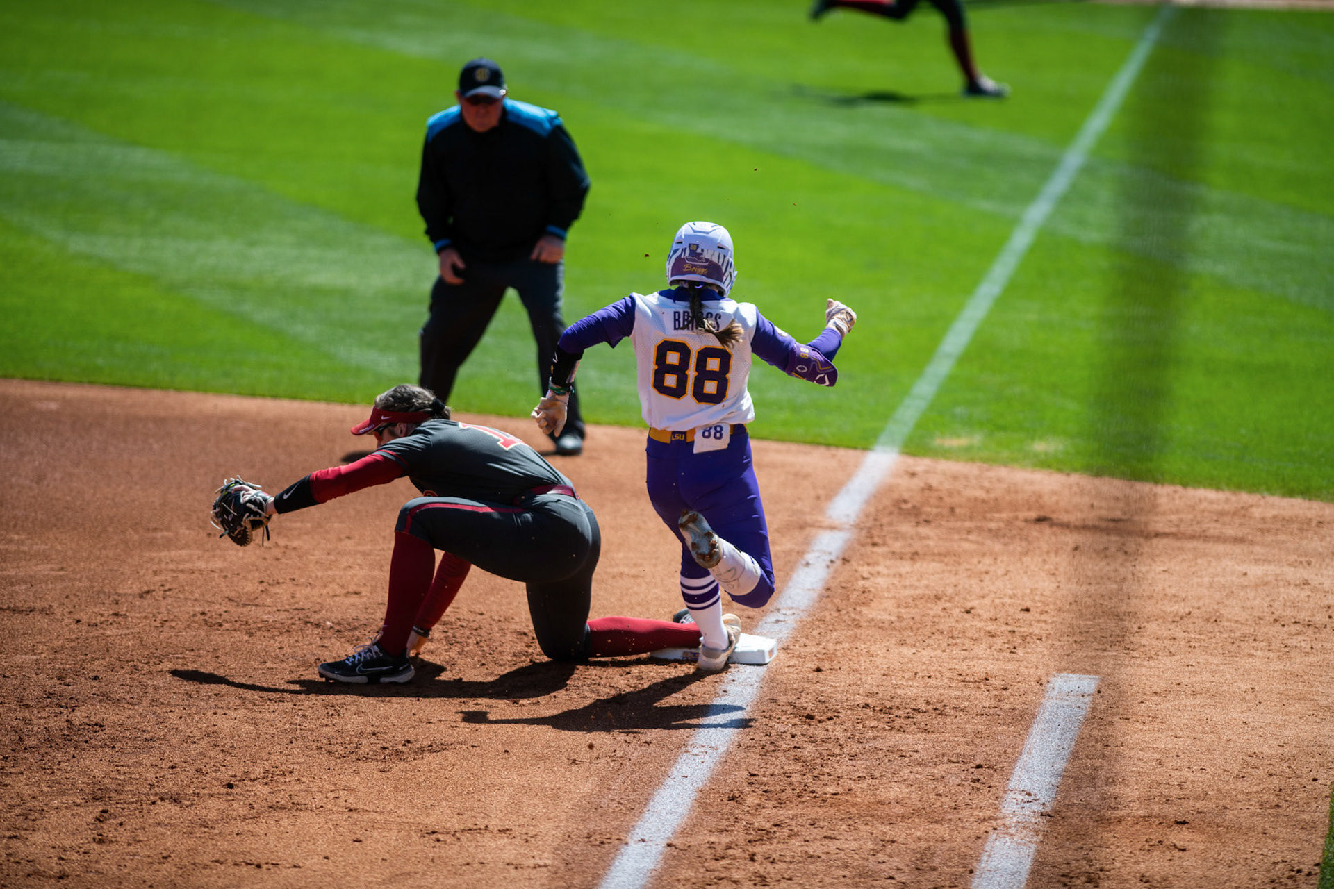 LSU softball redshirt sophomore outfielder Ciara Briggs (88) runs to first Saturday, March 12, 2022 during LSU's 13-6 win against Alabama at Tiger Park in Baton Rouge, La.