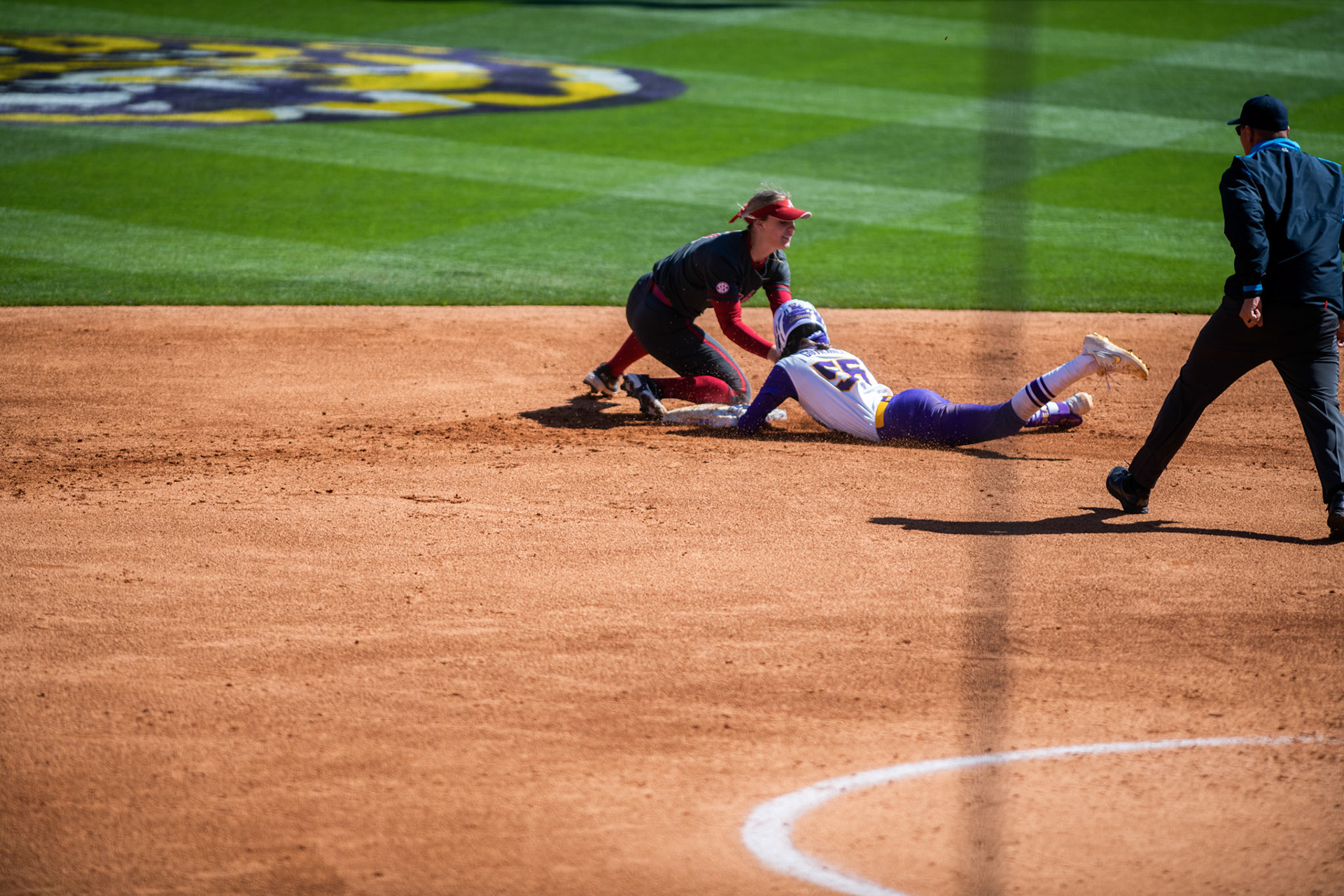 LSU softball redshirt sophomore Raeleen Gutierrez (55) slides safely into second base Saturday, March 12, 2022 during LSU's 10-6 ___ against Alabama at Tiger Park in Baton Rouge, La.
