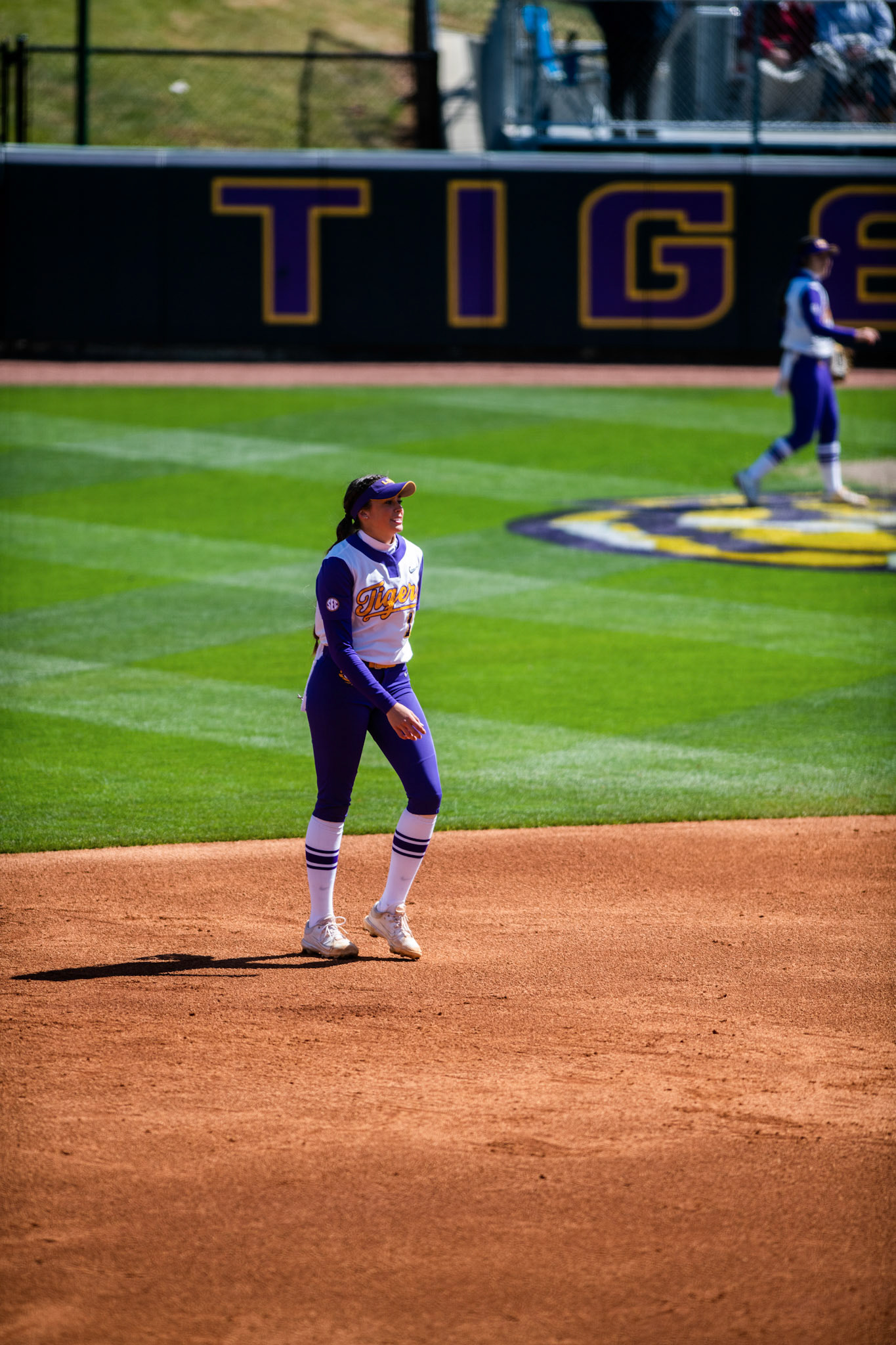 LSU softball redshirt sophomore infielder Taylor Pleasants (17) smiles after throwing out the runner at first Saturday, March 12, 2022 during LSU's 13-6 win against Alabama at Tiger Park in Baton Rouge, La.