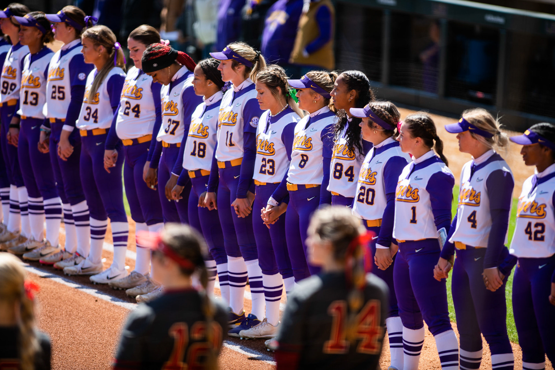 LSU softball stands for the national anthem Saturday, March 12, 2022 before LSU's 13-6 win against Alabama at Tiger Park in Baton Rouge, La.