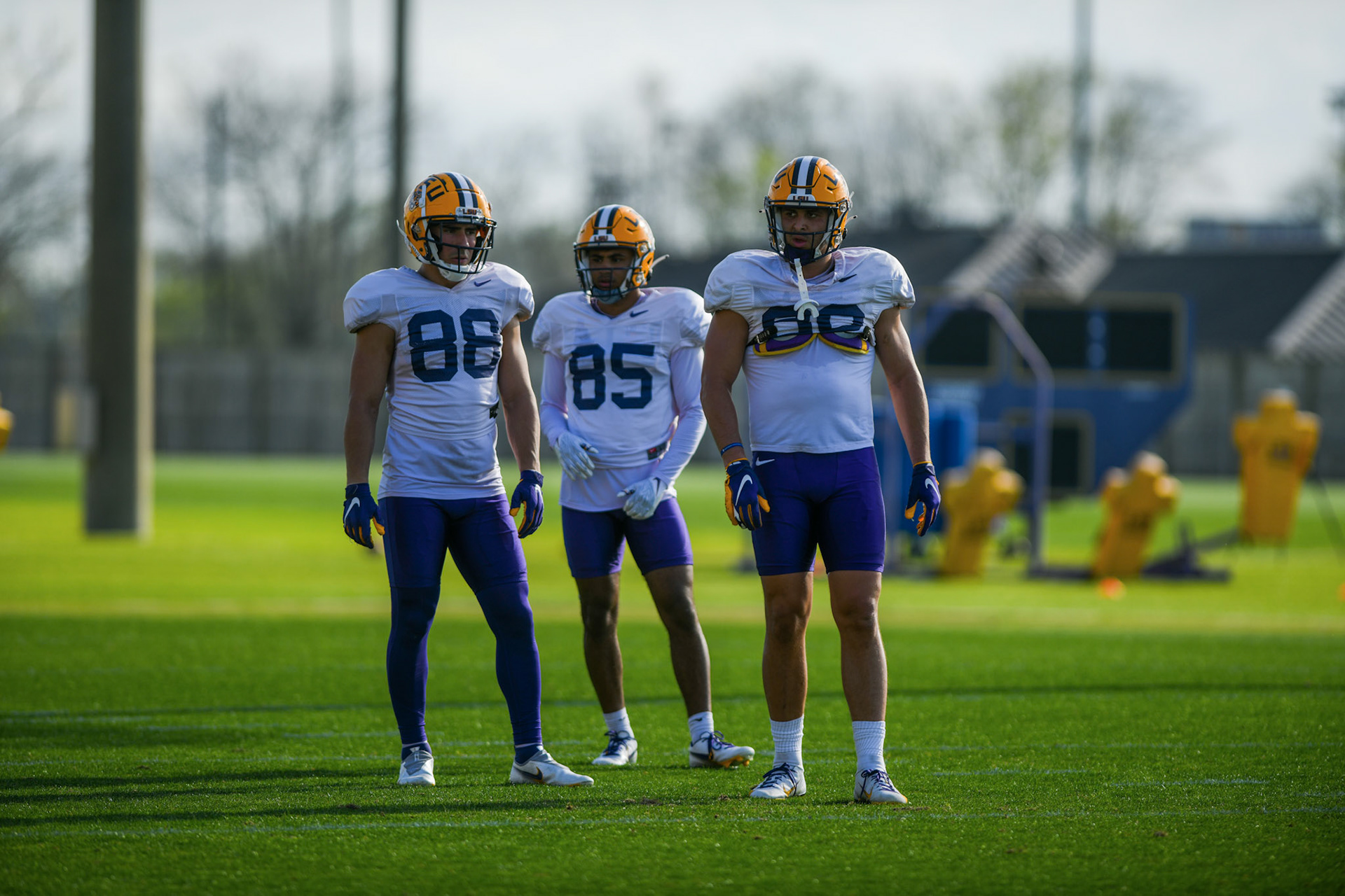 LSU football wide receivers Evan Francioni (88), LJ Gilyot (85), and Jack Bech (80) wait for the next drill Tuesday, March 29, 2022 during LSU's spring practice in Baton Rouge, La.