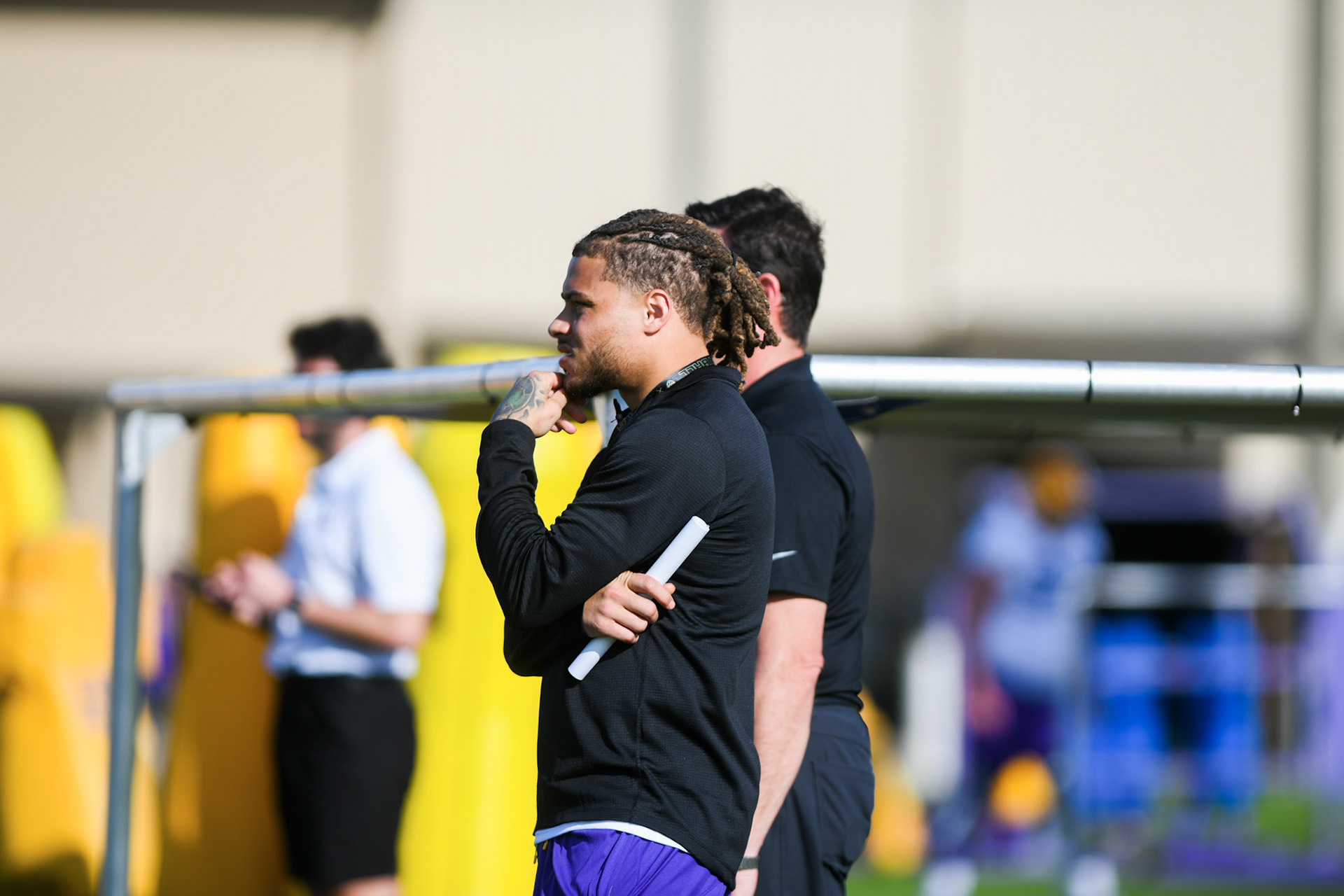 Former LSU football safety and Super Bowl Champion Tyrann Mathieu watches practice Tuesday, March 29, 2022 during LSU's spring practice in Baton Rouge, La.