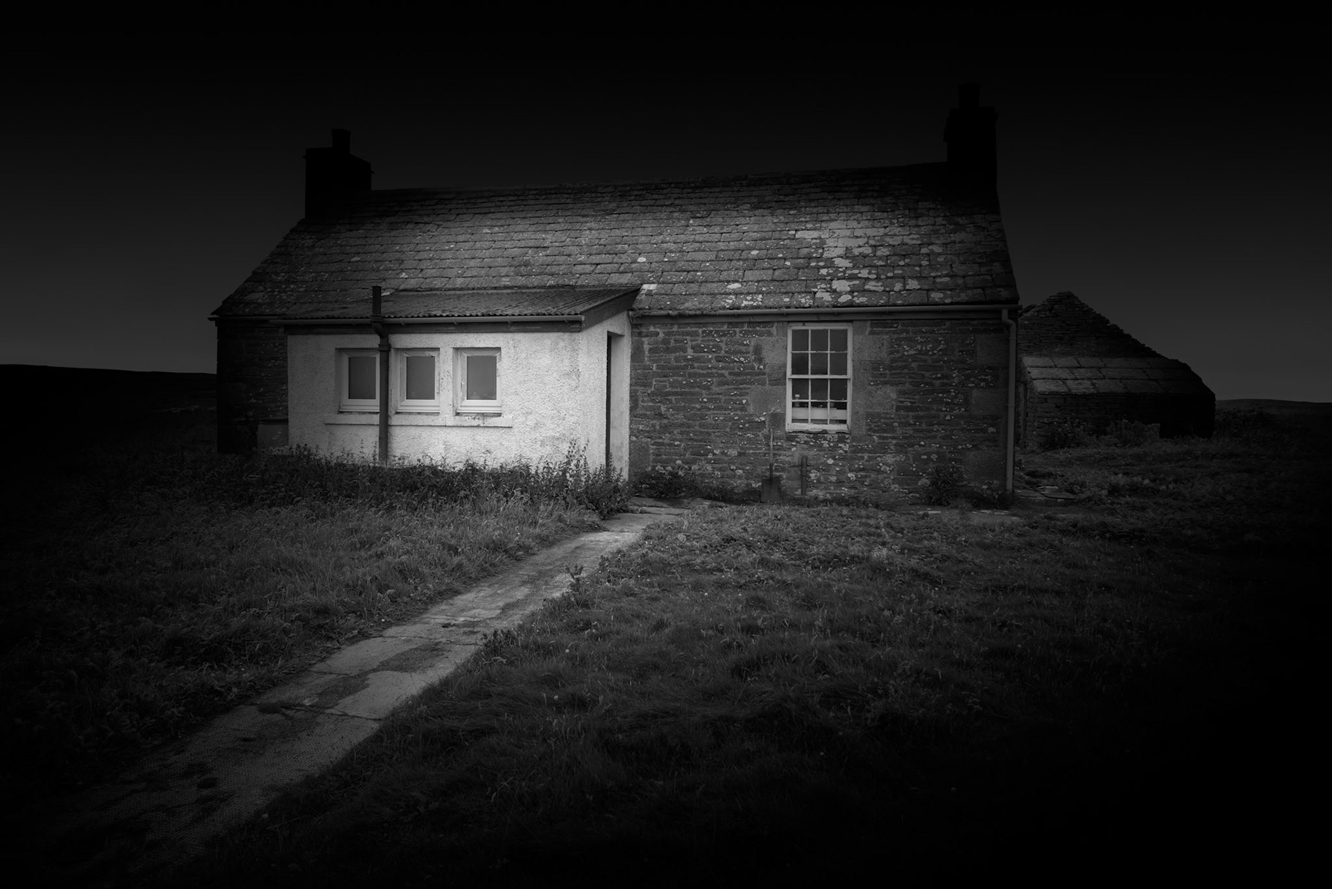 The Nurse's House is one of the most intact domestic buildings remaining on Stroma and provides an important counterpoint to the island's many roofless crofts. Its survival also complicates the idea of Stroma as simply an abandoned island. Although there is no longer a permanent community, the island continues to be farmed, and the house is used by farm workers when they need shelter, retaining basic facilities including a functioning flushing toilet. The worn path leading towards the building was important to me when making this photograph. It gives the house a connection to the surrounding landscape and suggests continued movement and use. Stroma may have lost its permanent population, but human activity has never entirely disappeared.Stroma is an ongoing photographic project which I am currently developing.