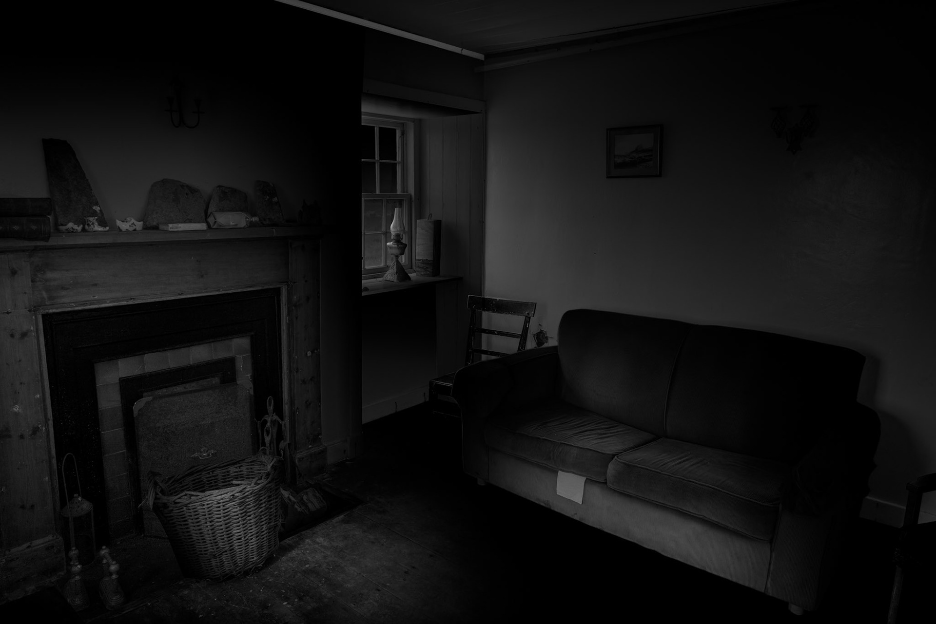 Of all Stroma's surviving spaces, domestic rooms perhaps make the disappearance of its community most tangible. A fireplace, armchair, sofa and objects on the mantelpiece transform this from an architectural interior into somewhere recognisably associated with everyday life. Yet the Nurse's House has not been completely abandoned. It provides shelter for the farm workers who continue to use the island, so its interiors occupy an unusual position between past and present. I deliberately allowed much of the room to disappear into shadow, drawing attention instead to these familiar objects and the traces of light entering through the window. The result is less about dereliction than absence: an ordinary room in a place where the ordinary patterns of permanent domestic life have disappeared.Stroma is an ongoing photographic project which I am currently developing.