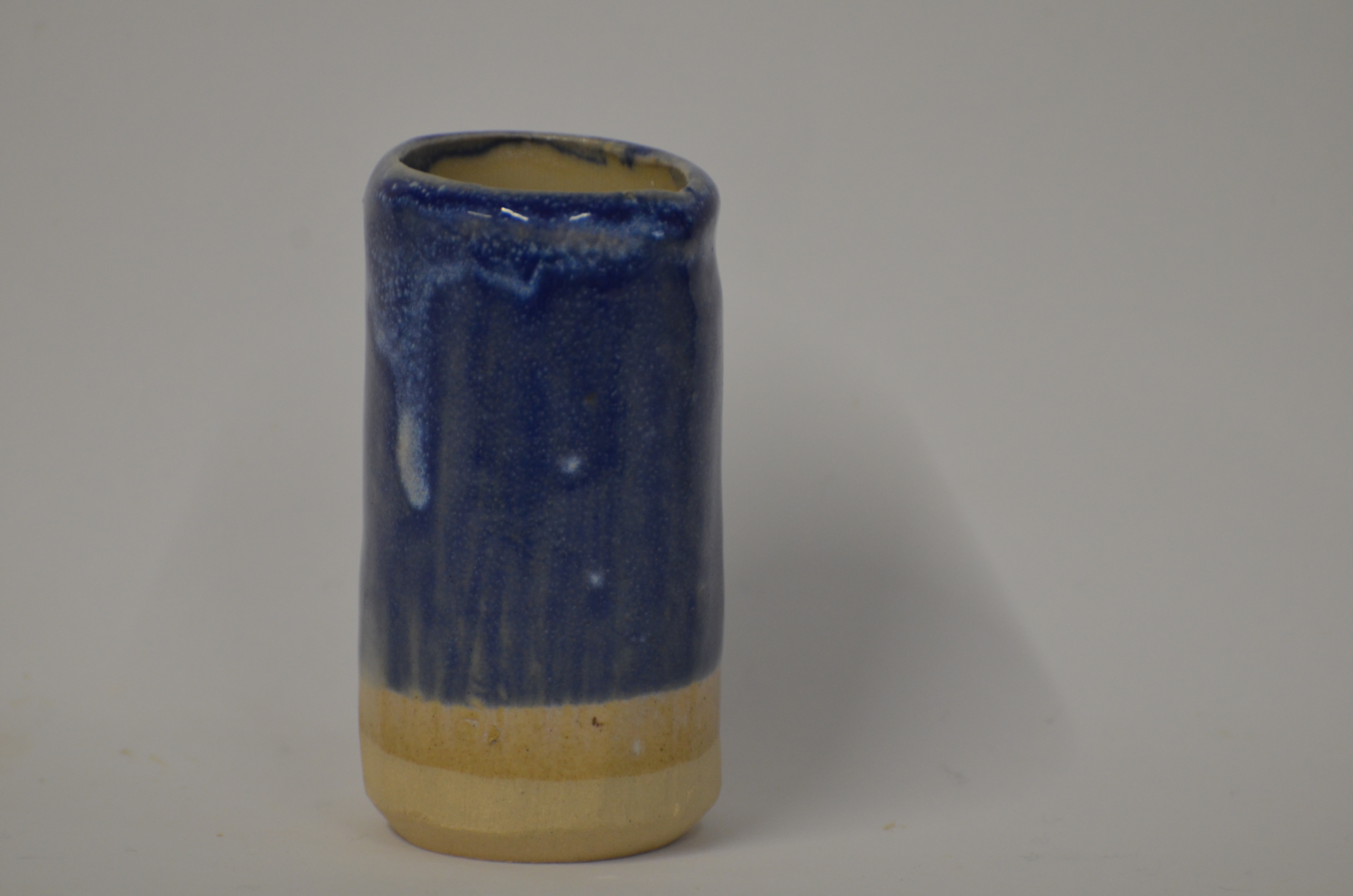 A very stable blue cobalt glaze was dipped over a honey flux glaze to create interest