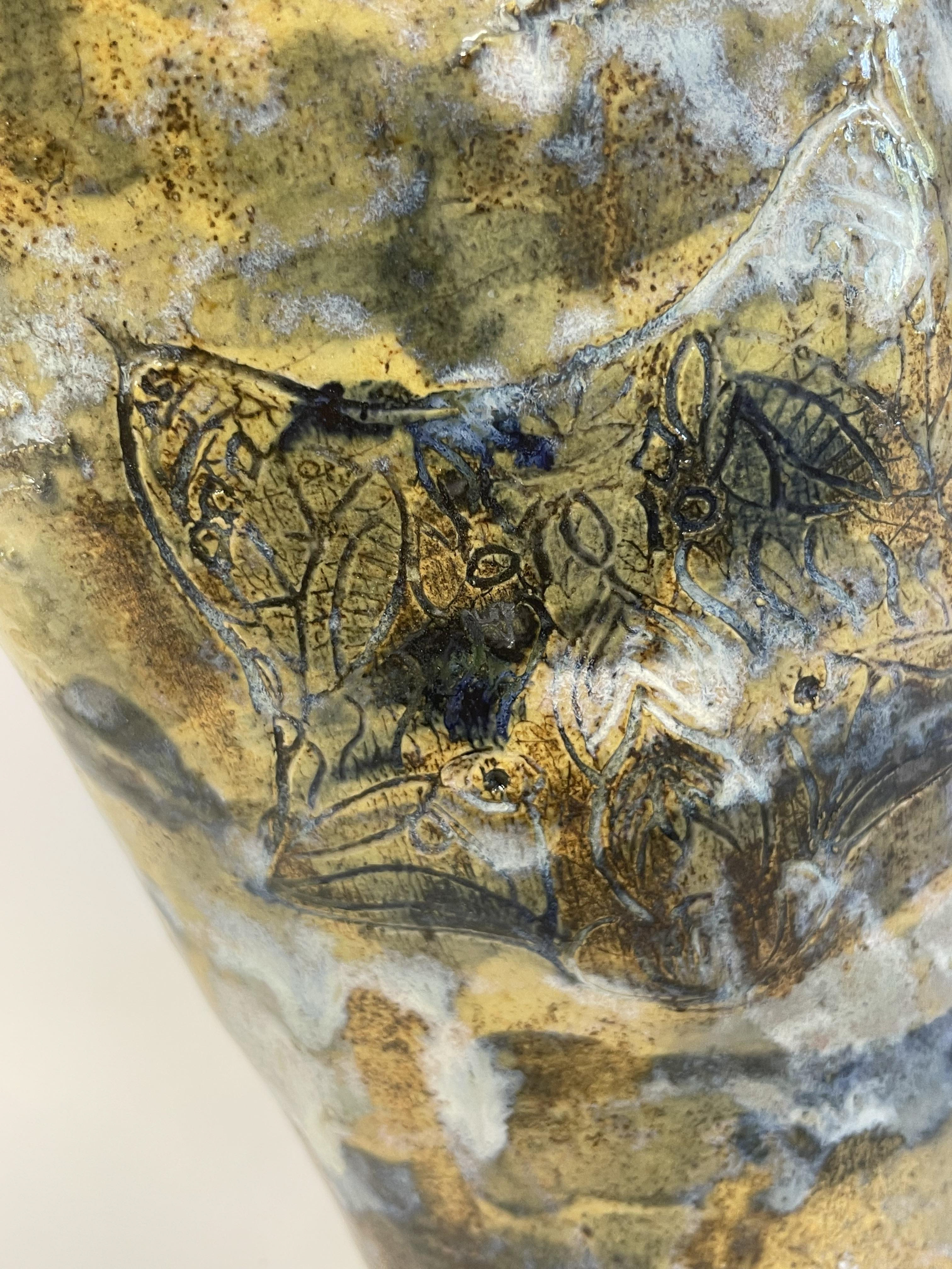 A stamp, slips and various glazes all created interest