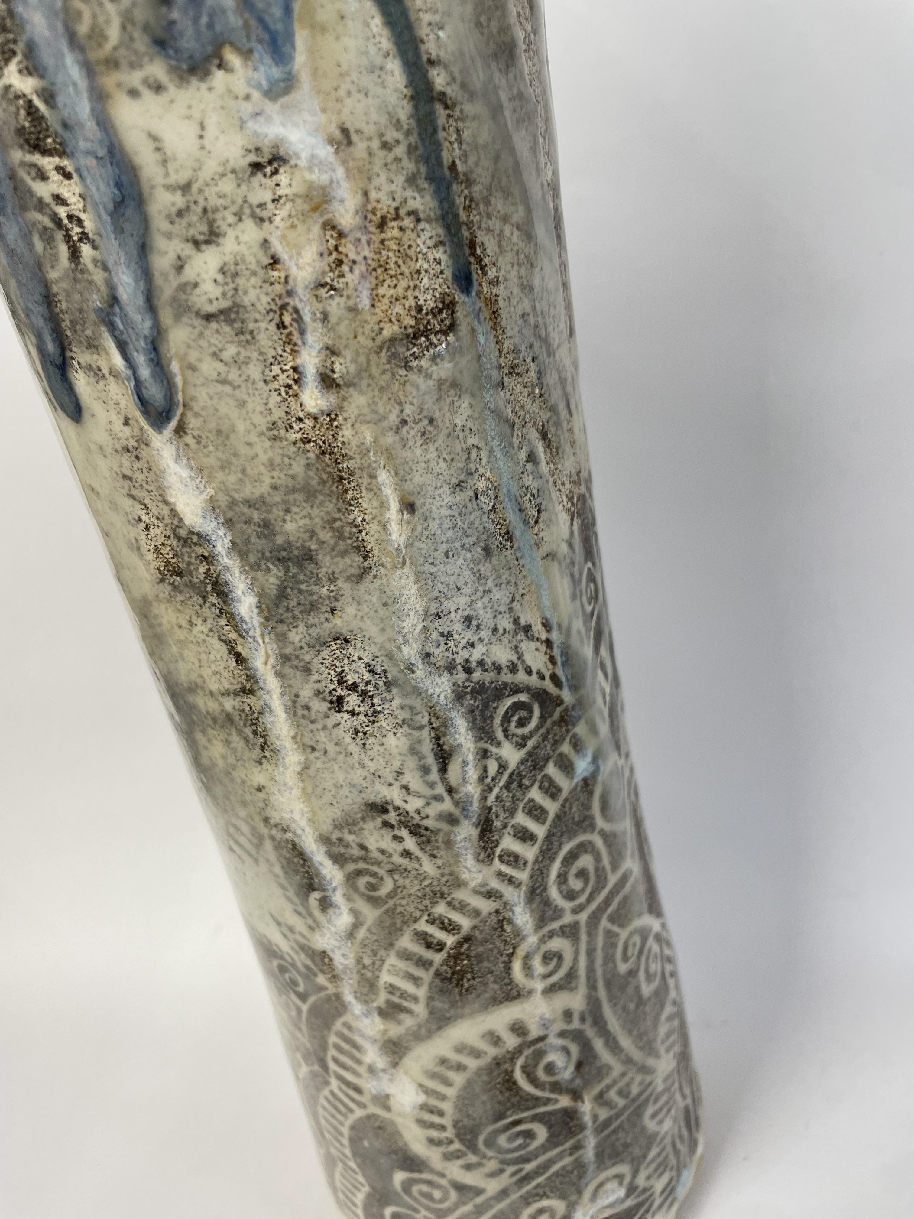 Slips were added to the base and through a stencil giving a soft feel to the colours. Various glazes were added to create interest.