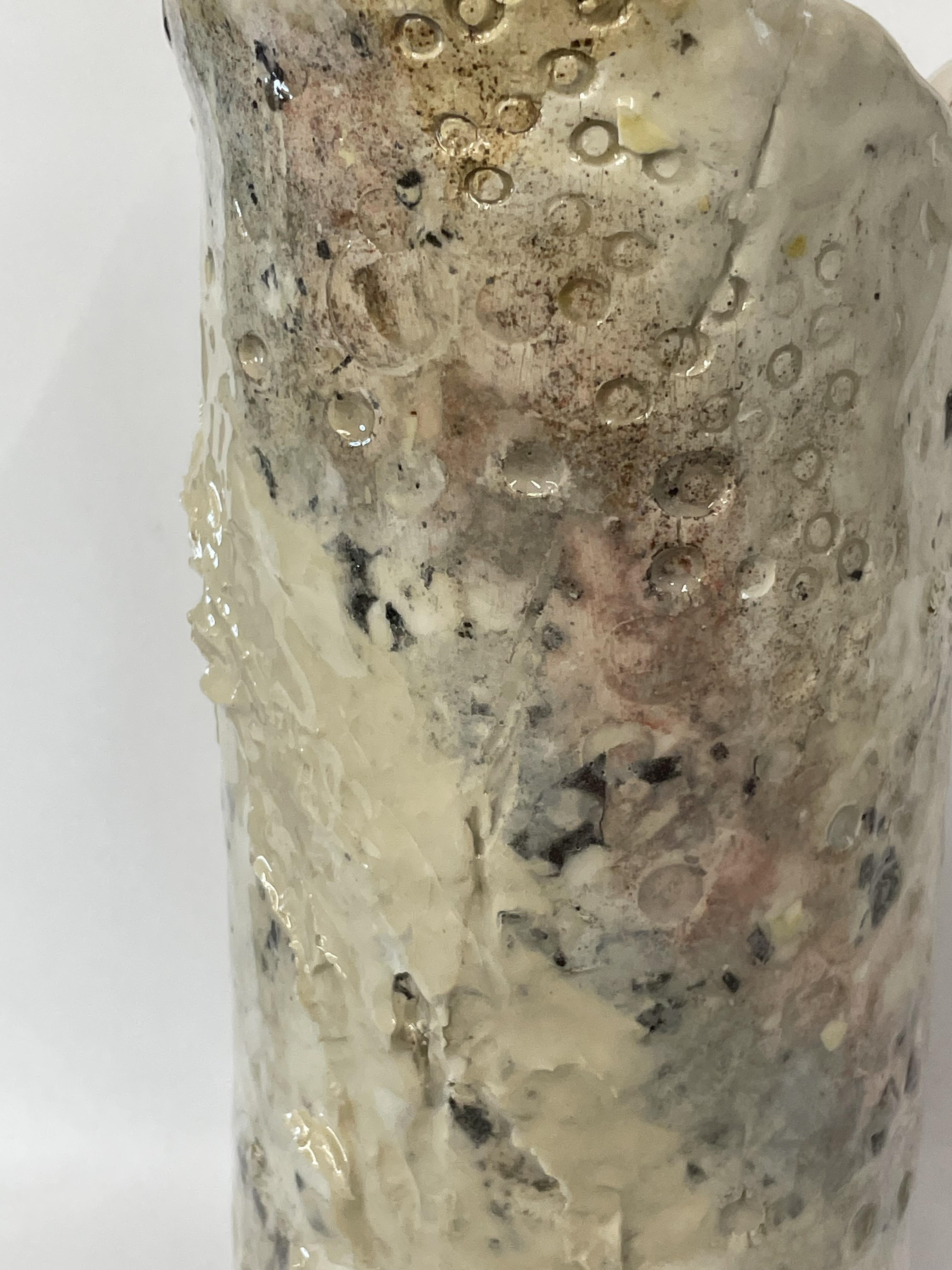 Vase made as an extension from my texture library. Slips and mark makings
