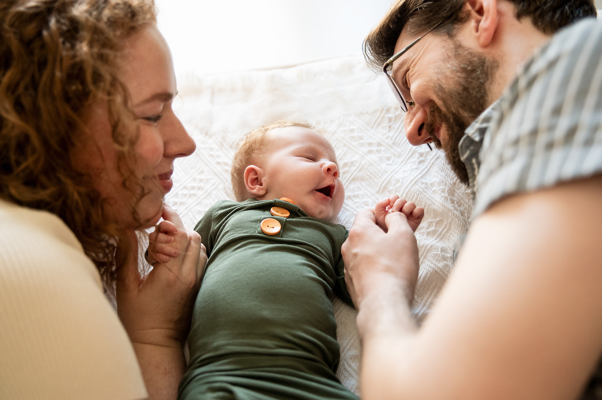 parents playing with their newborn. Family Portrait by Priscila Medeiros in bangkok