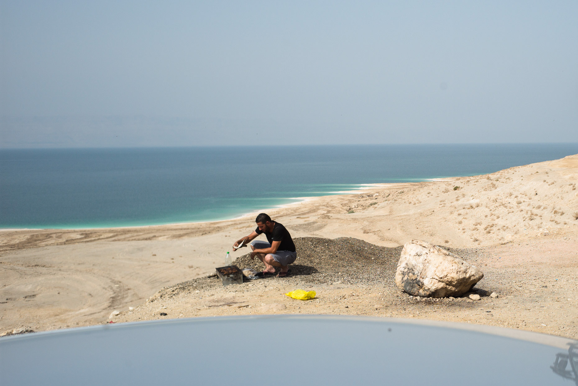 A truck driver preparing barbecue along the Jordan Valley Highway in October 2017 at the Dead Sea in Jordan.