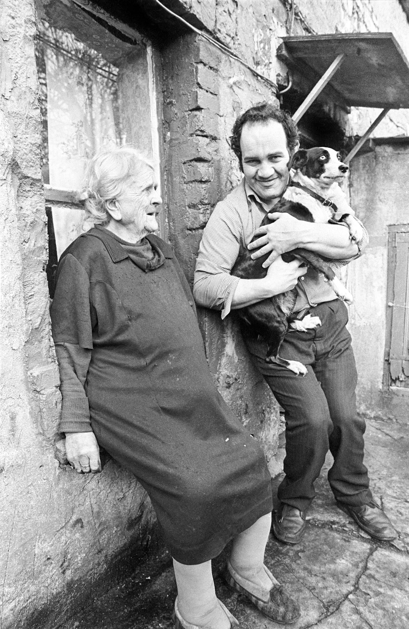 Maggie Perrin and her son Mansell - Maggie had her own stone on the edge of a coal tip. On sunny days she would always be found sitting on this stone greeting passers-by. Her son Mansell had been born with a health problems.
