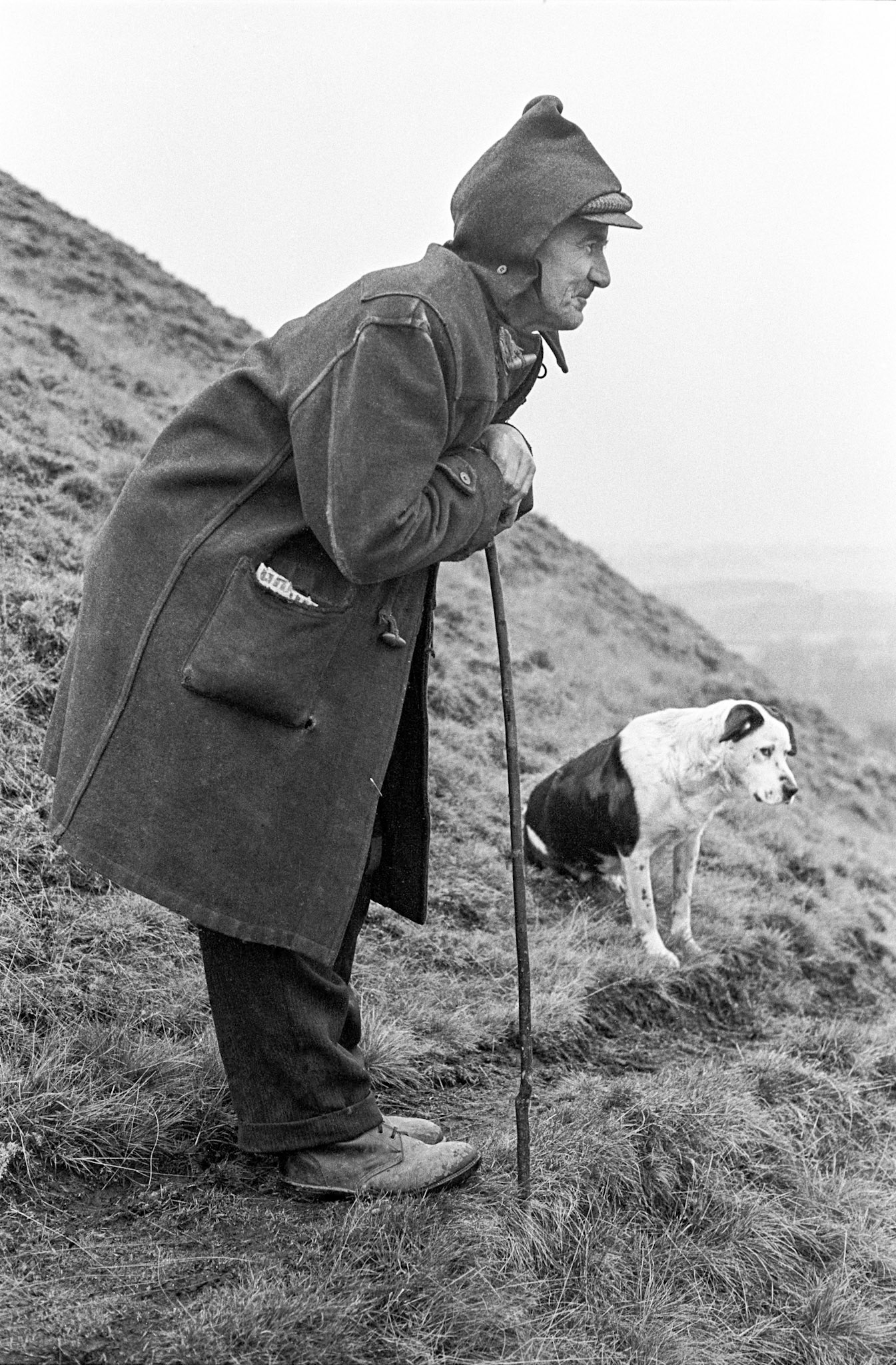 Dai Passmore and his dog - Dai could often be found wandering the slag tips above Heolgerrig. He had a complex of sheds at the bottom of the tips where he kept ferrets and pigs. He used to be seen driving a horse and cart around town. He liked Stout. This photograph was taken on Jan 4th 1972. It started to snow just as I took the photograph. It was a very light snow. I came across Tudor as he paused for breath while walking on the steep tip. It remember it so well because it was at this precise moment that my Nan passed away.