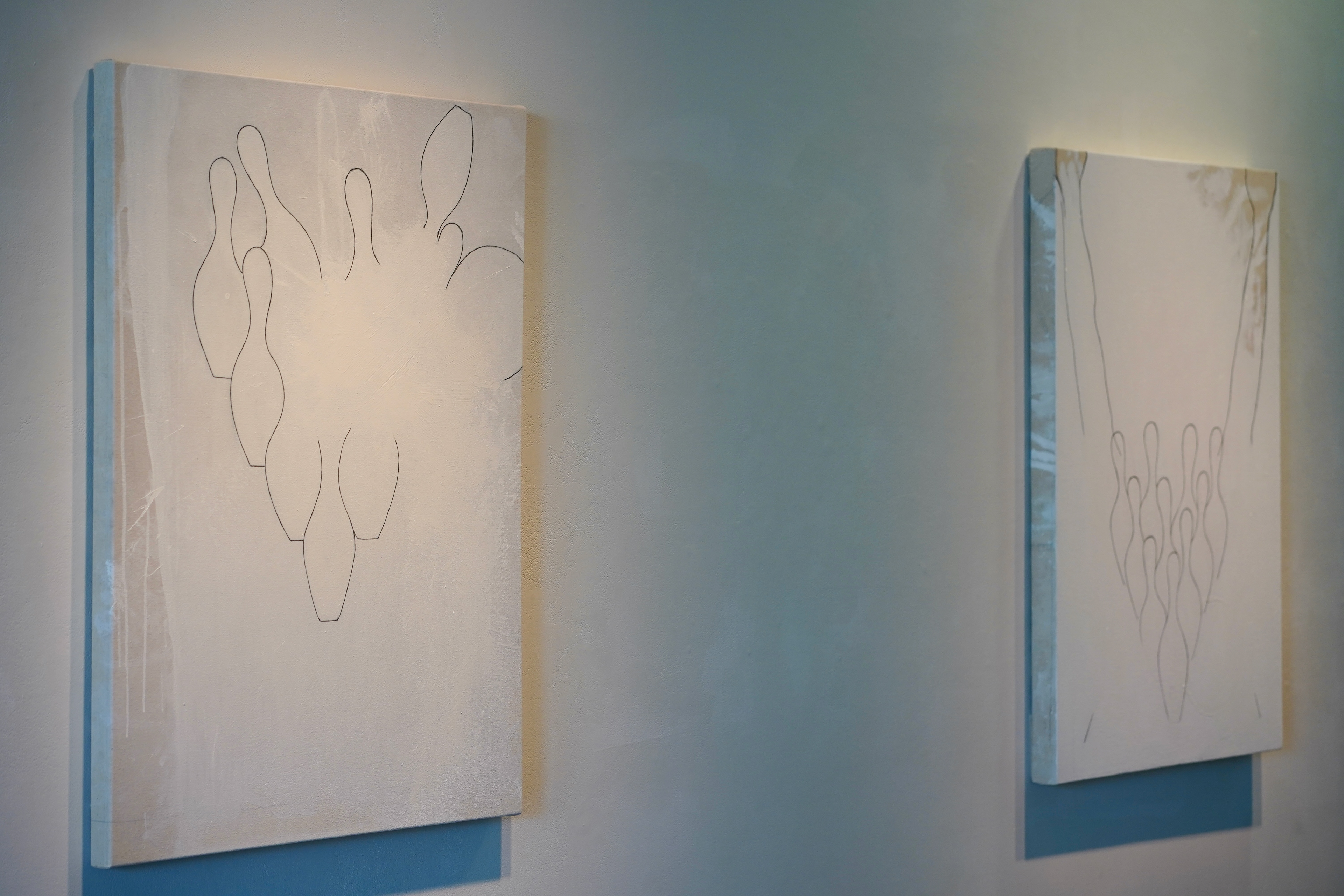 (left) Max Heaton, Âme, 2024, Acrylic and graphite on canvas and (right) Max Heaton, Cliffhanger, 2024, Acrylic and graphite on canvas