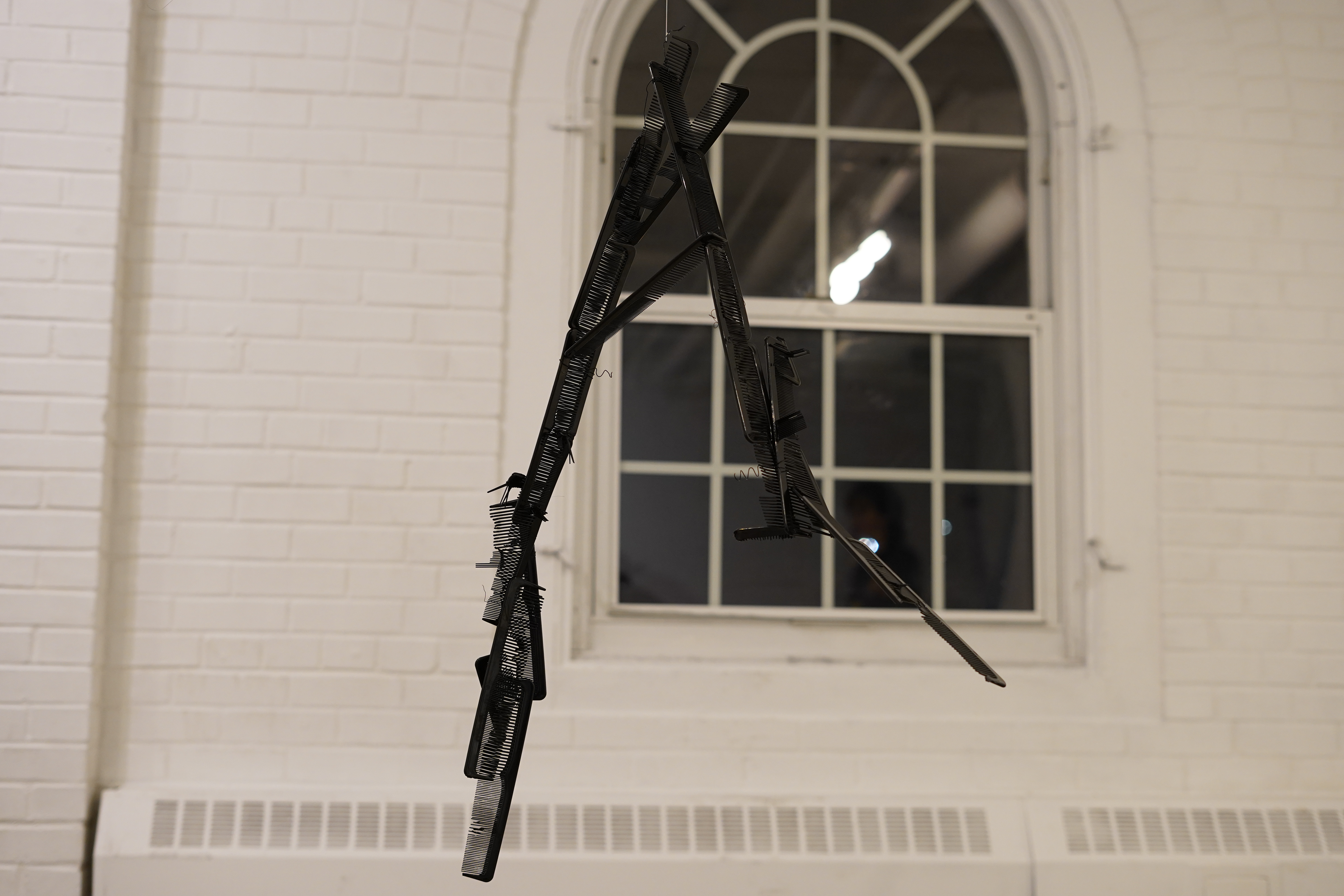 Kameo Chambers, Stranded, 2024, Plastic Combs, 21 in x 6 in x 24 in 