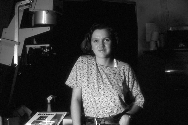 Laura working with glass plate negatives and archival photography at the Klamath Museum, 1992