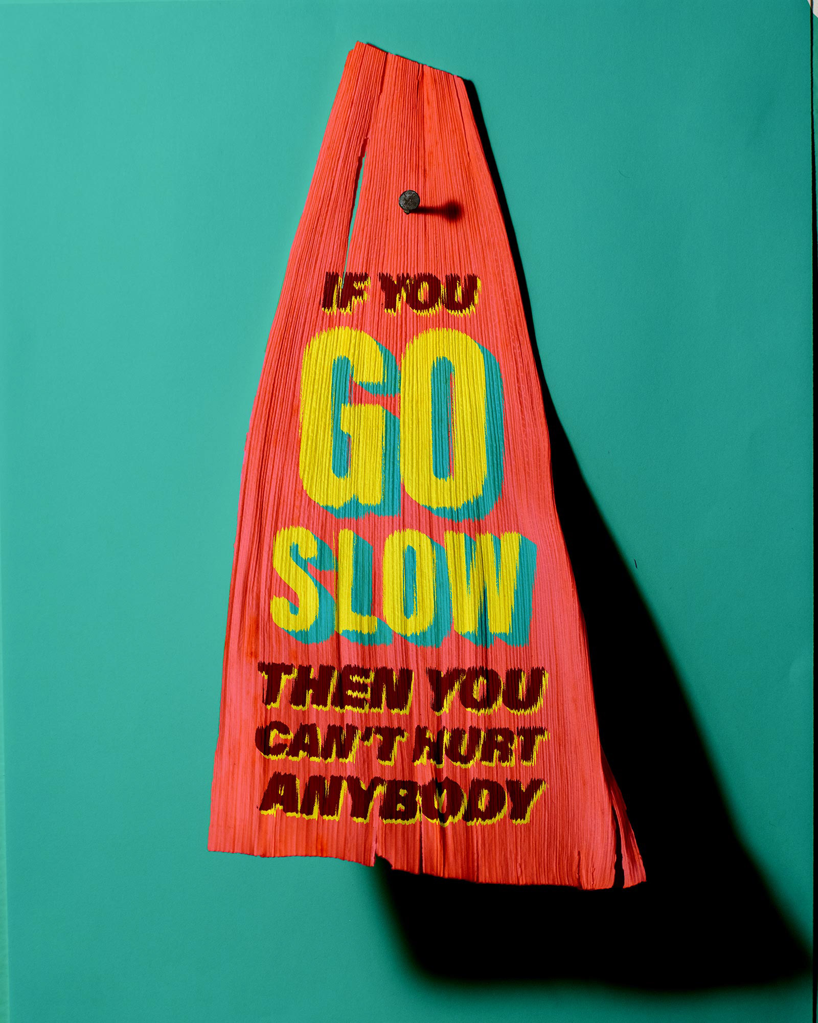 Tamale corn husk that says, "If you go slow, then you can't hurt anybody."