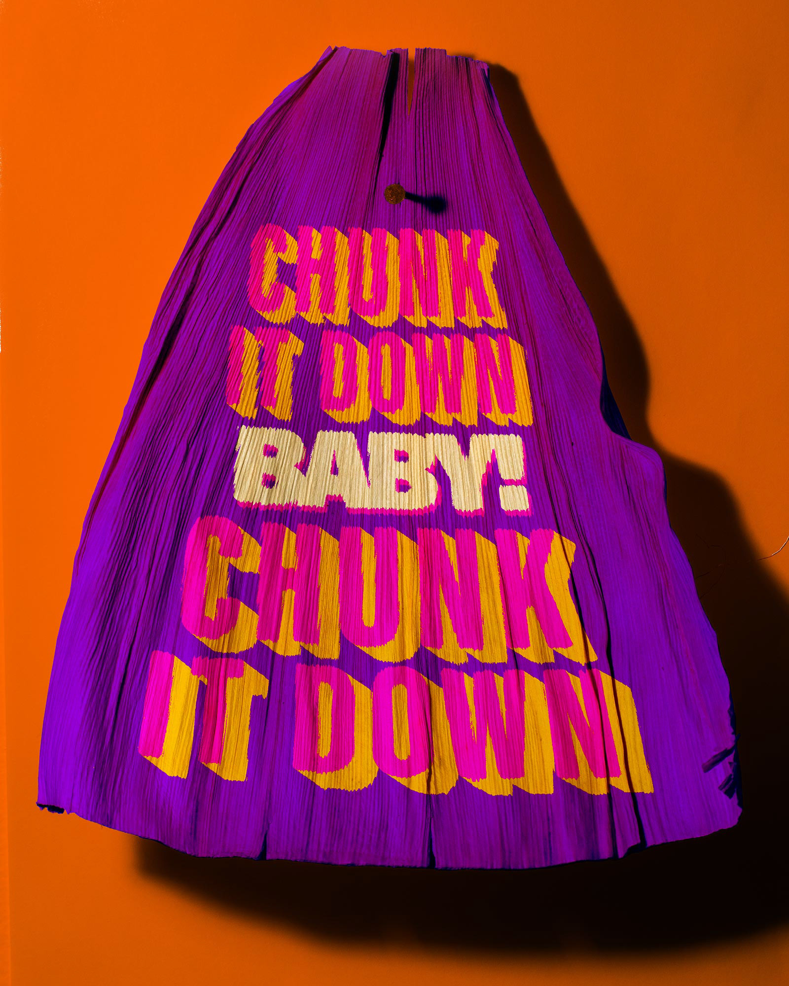 Tamale corn husk that says "Chunk it down, baby! Chunk it down"